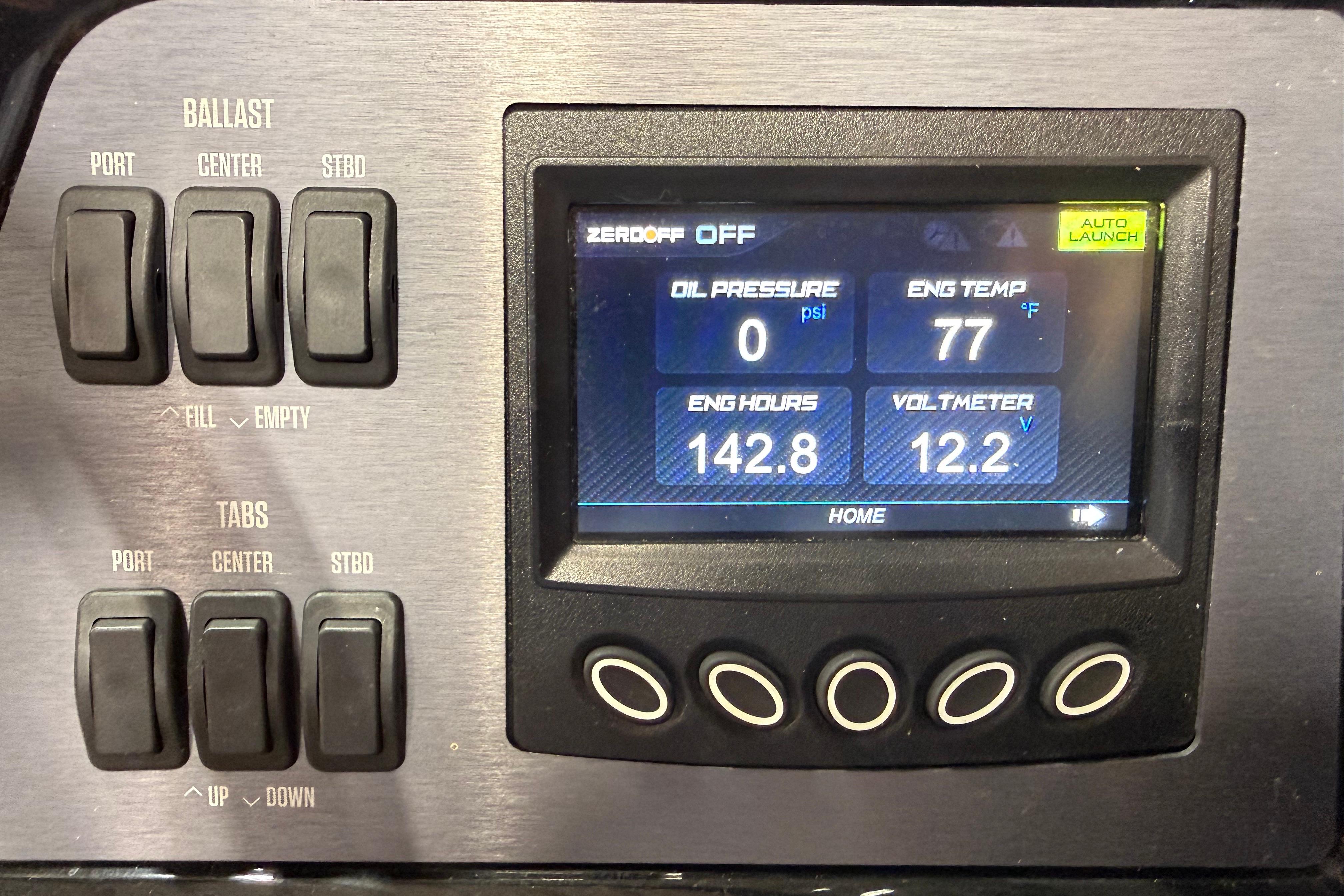 Control panel of a 2022 MasterCraft NXT24 boat displaying engine metrics and ballast controls.