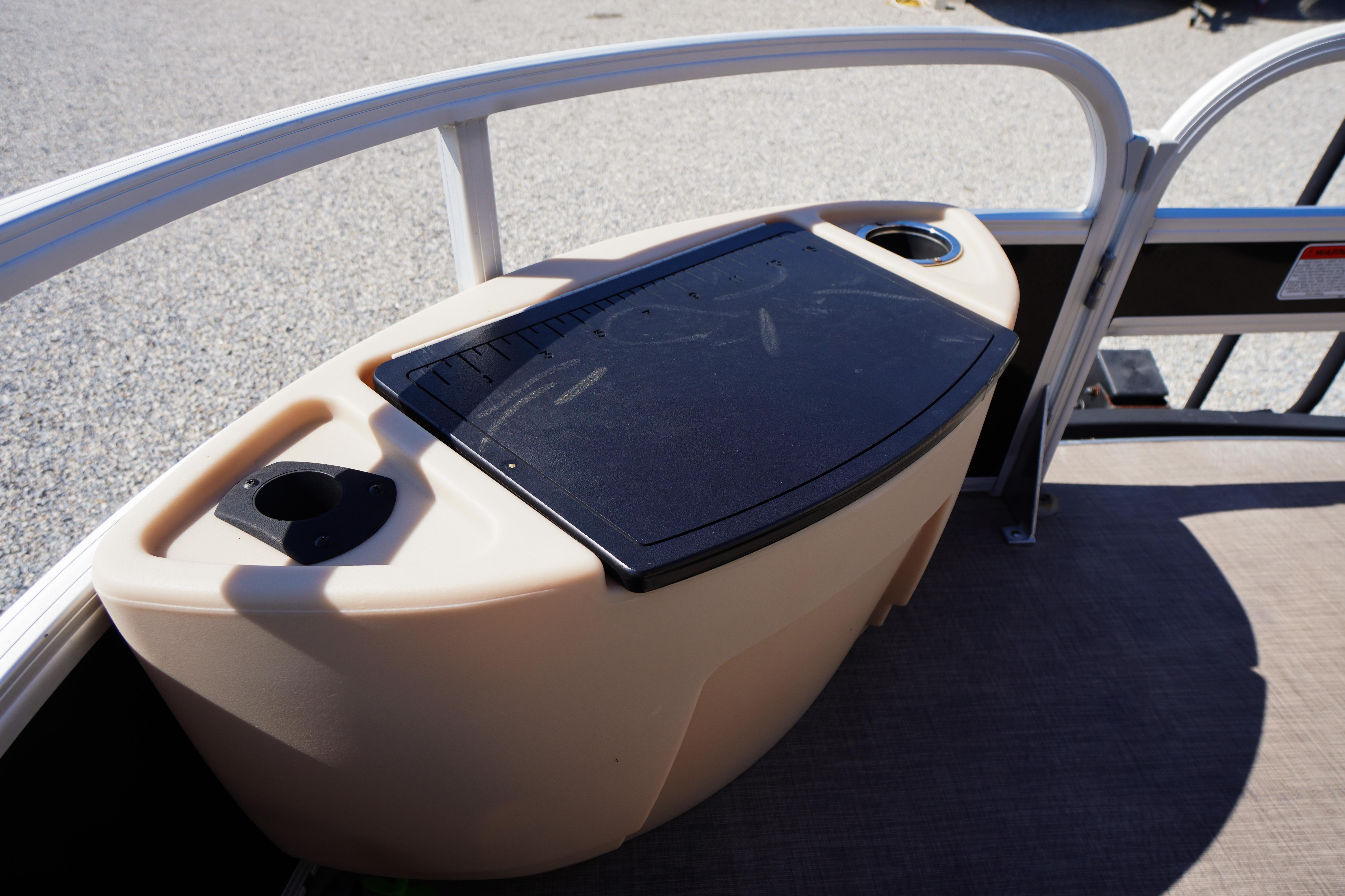 2019 SUNTRACKER Fishin' Barge 22 DLX boat console with cup holders and storage.