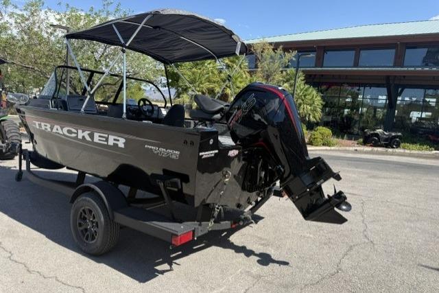 2026 Tracker Pro Guide V-175 Combo boat on trailer, parked outdoors.