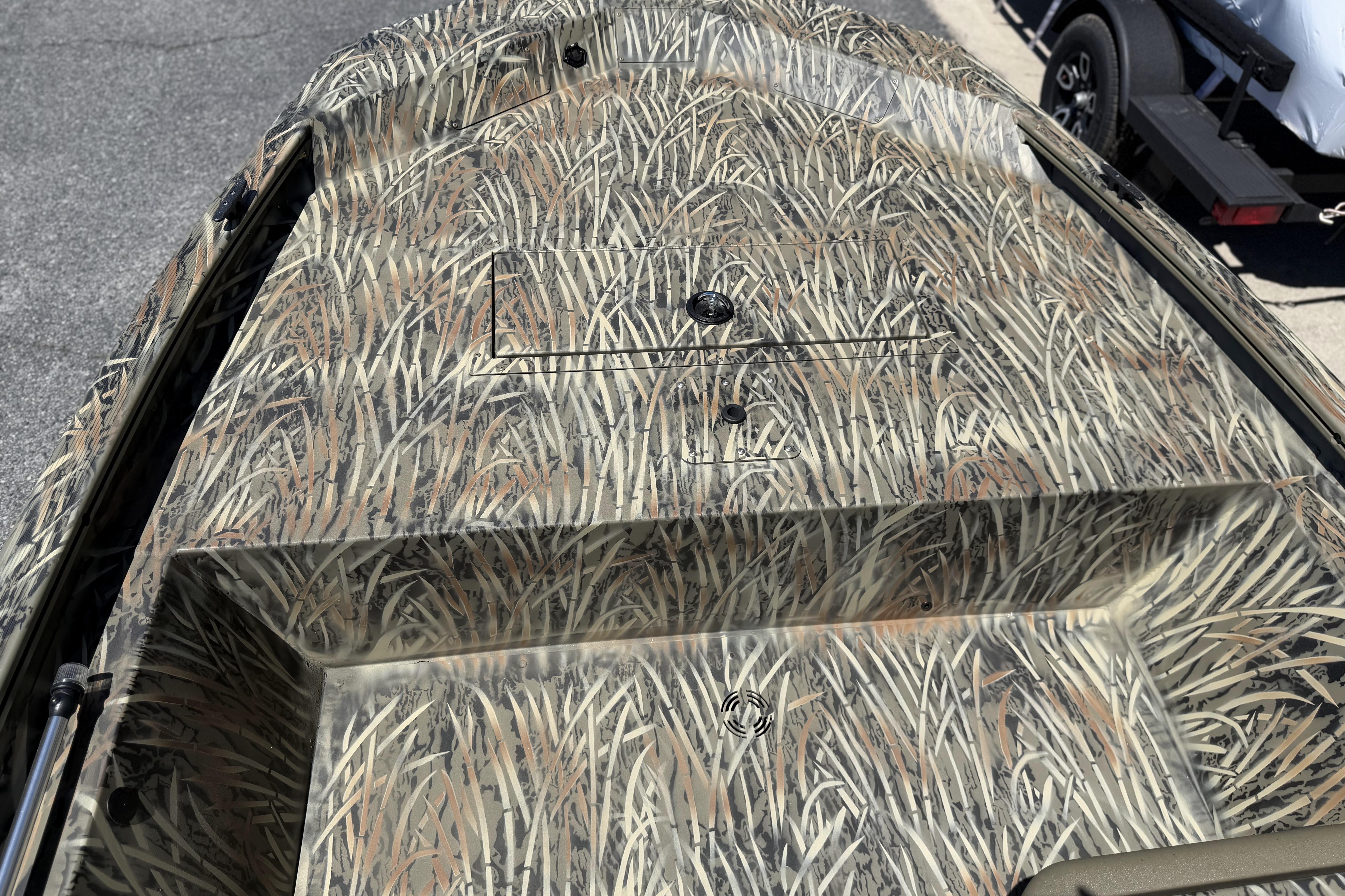 2026 Tracker Grizzly 1648 SC boat with camouflage pattern on deck.