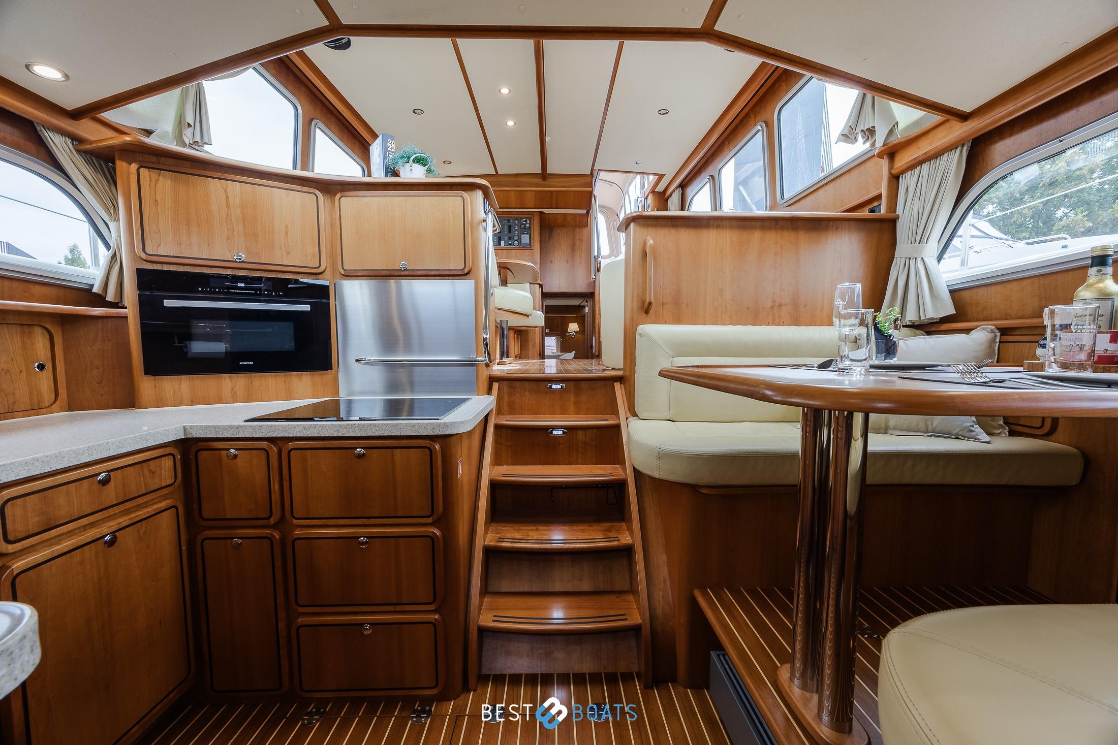Luxurious interior of 2010 Linssen Grand Sturdy 470 AC Mark II Twin yacht, featuring wood finishes.