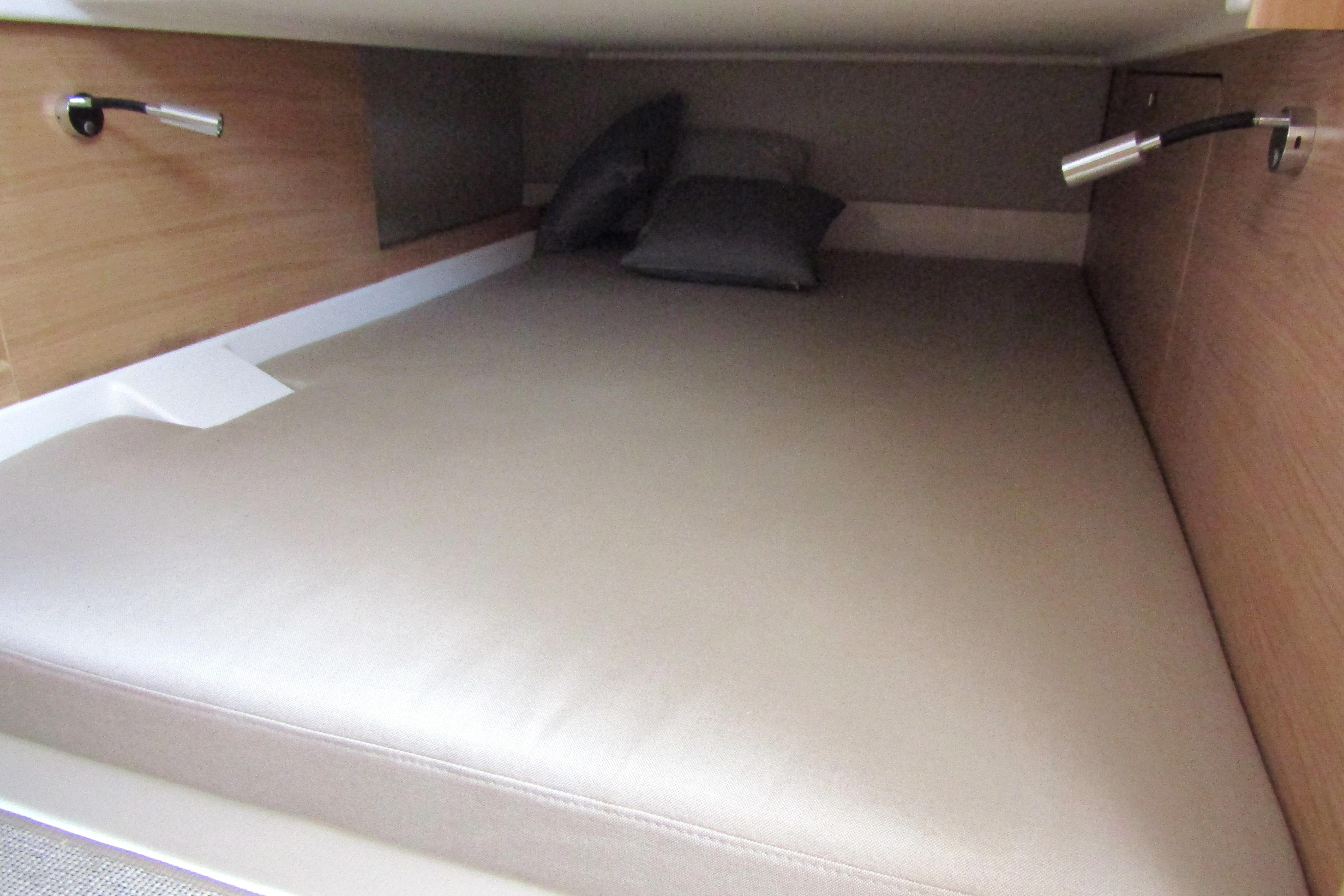 Cozy cabin bed in 2025 Nimbus Tender 11 yacht with modern lighting.