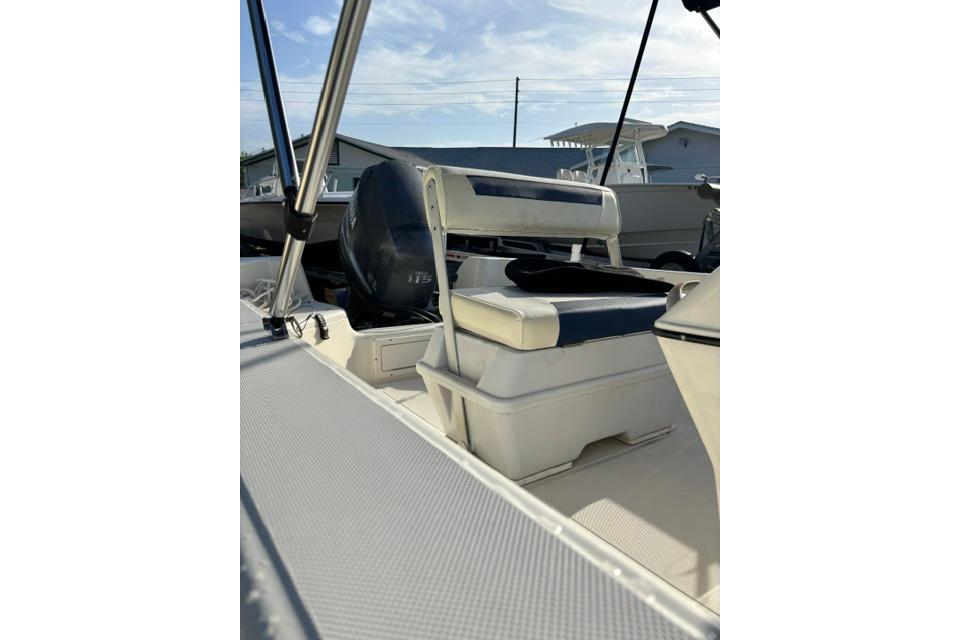 2005 Hydra-Sports Lightning 180 CC boat interior with seating and motor, under clear sky.