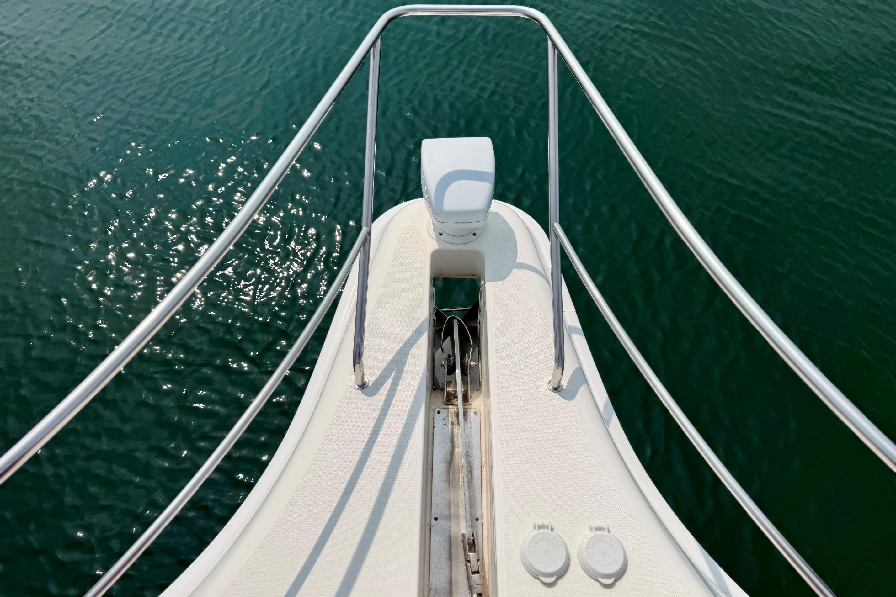 Bow view of 2004 Silverton 39 Motor Yacht on calm water.