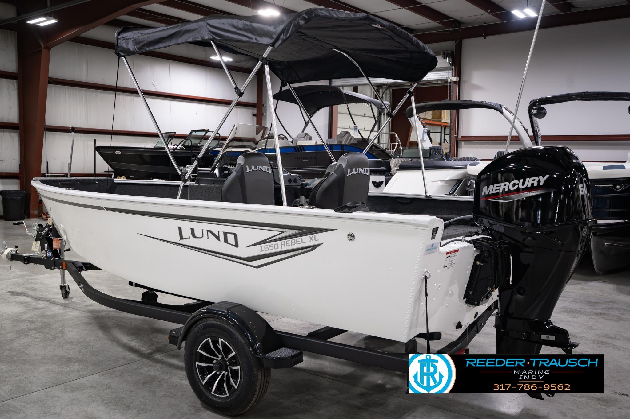 2026 Lund 1650 Rebel XL SS boat with Mercury engine in showroom.
