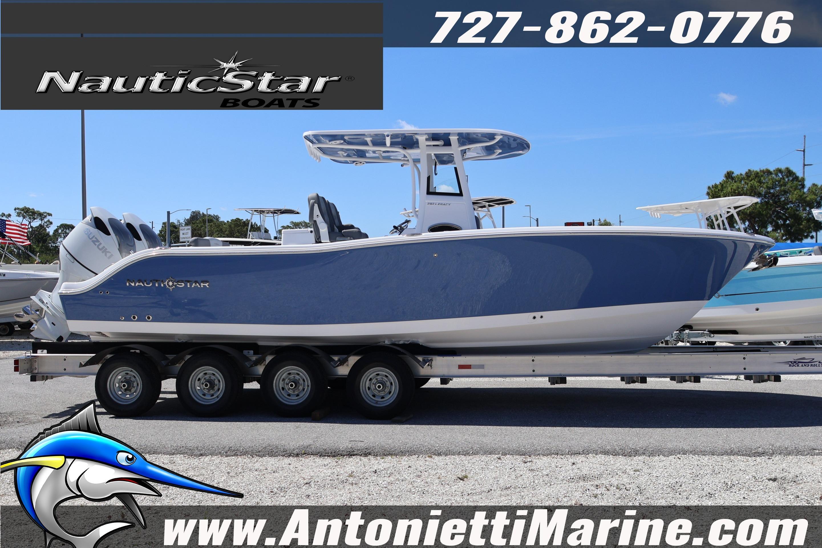 2026 NauticStar 292 Legacy boat on trailer at Antonietti Marine dealership.