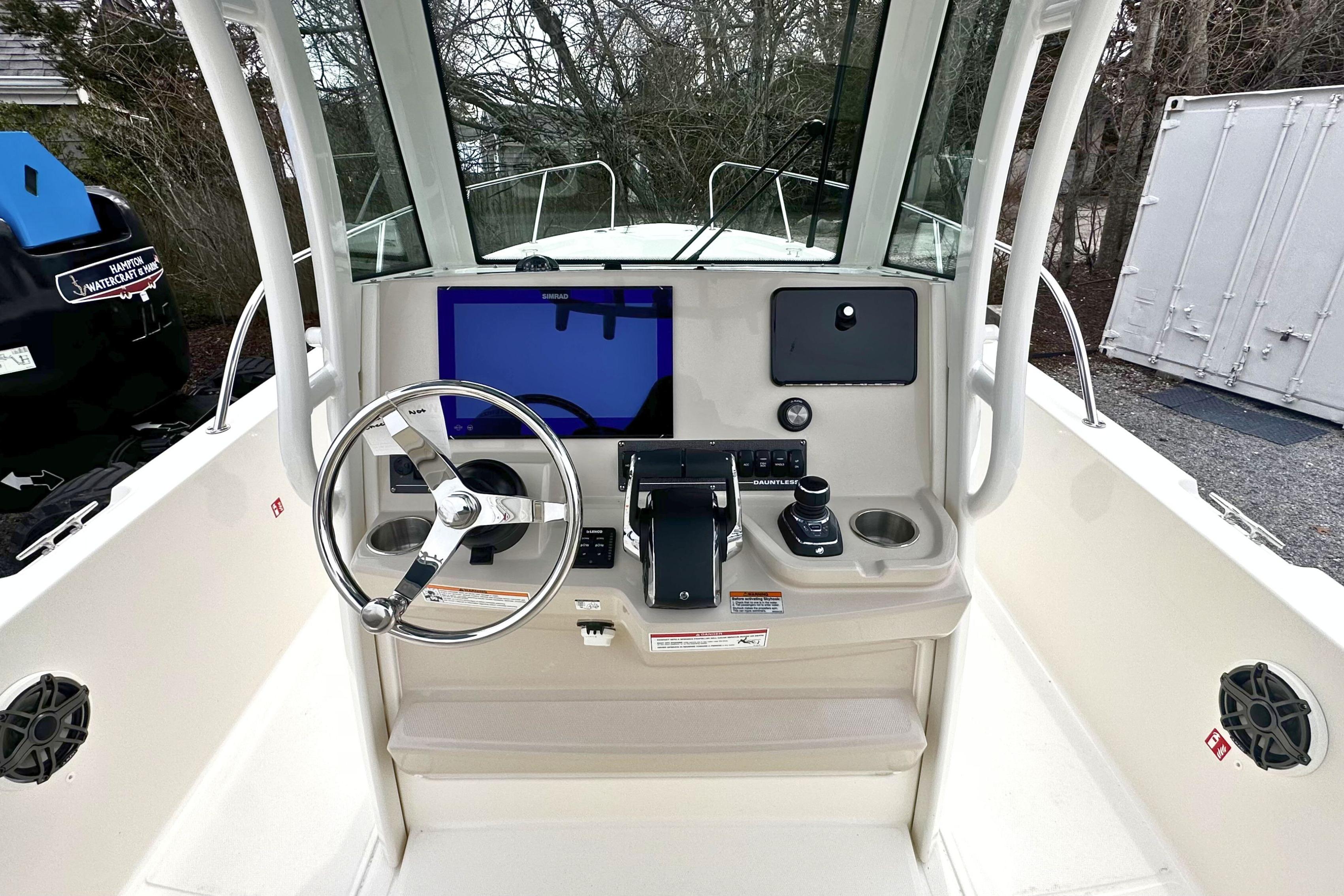 2026 Boston Whaler 280 Dauntless helm with steering wheel and navigation display.