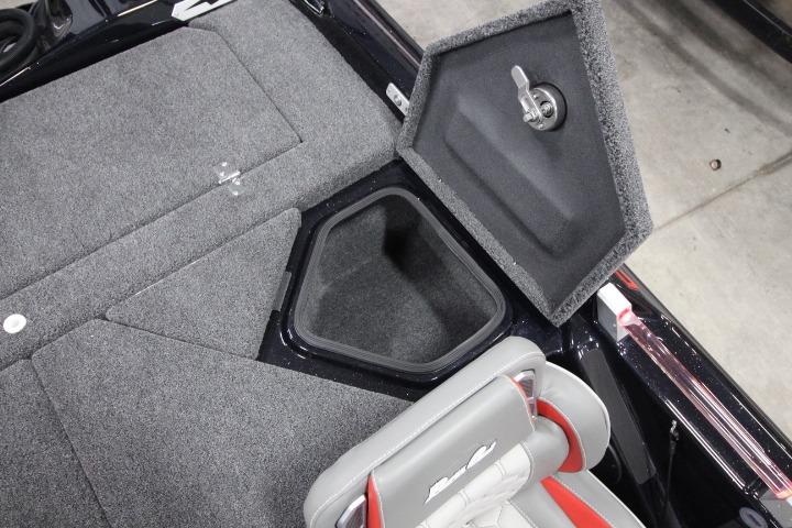 2026 BassCat CougarFTDSP boat storage compartment with open lid and cushioned seat.