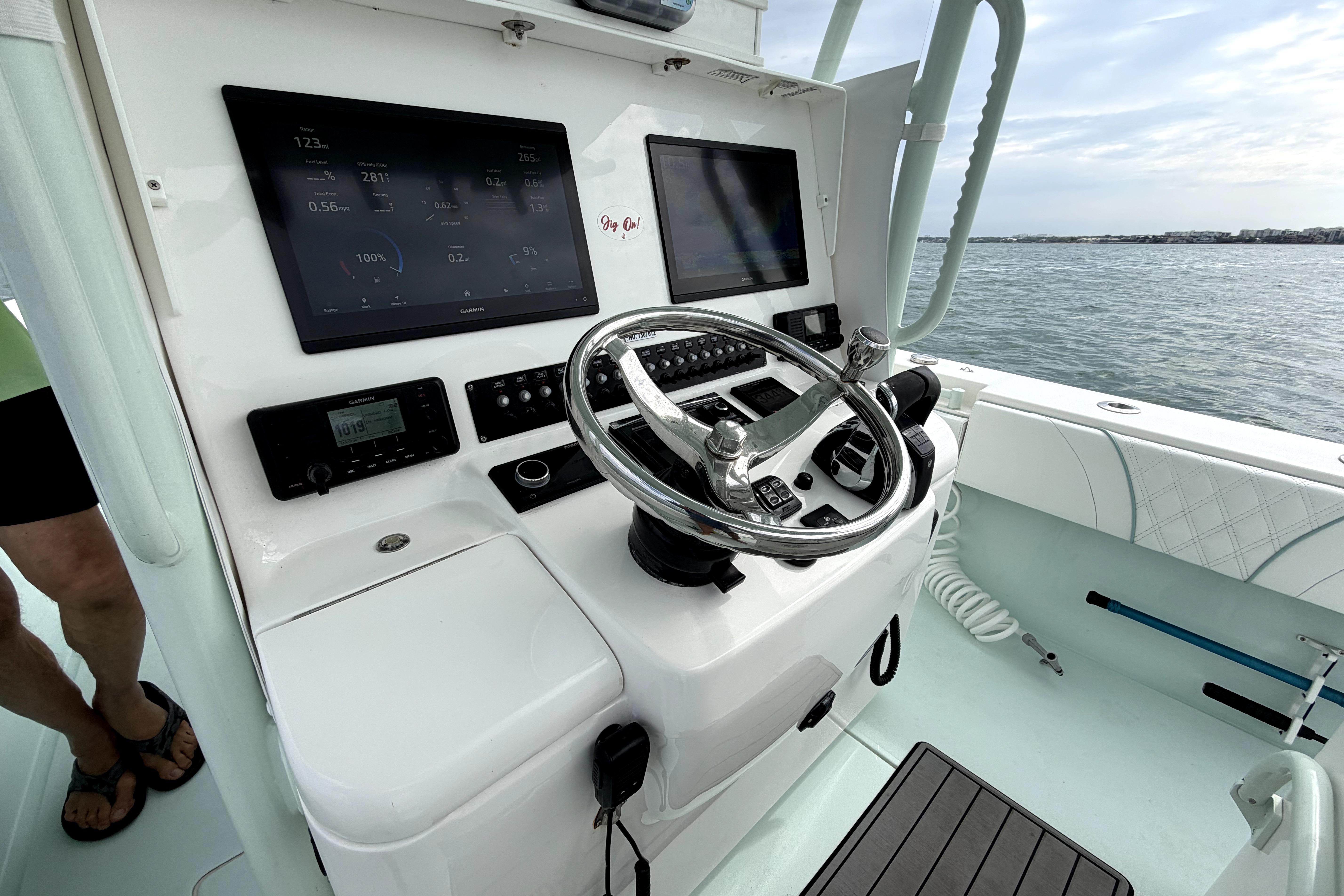 2019 Contender 30 ST boat helm with modern navigation displays and steering wheel.