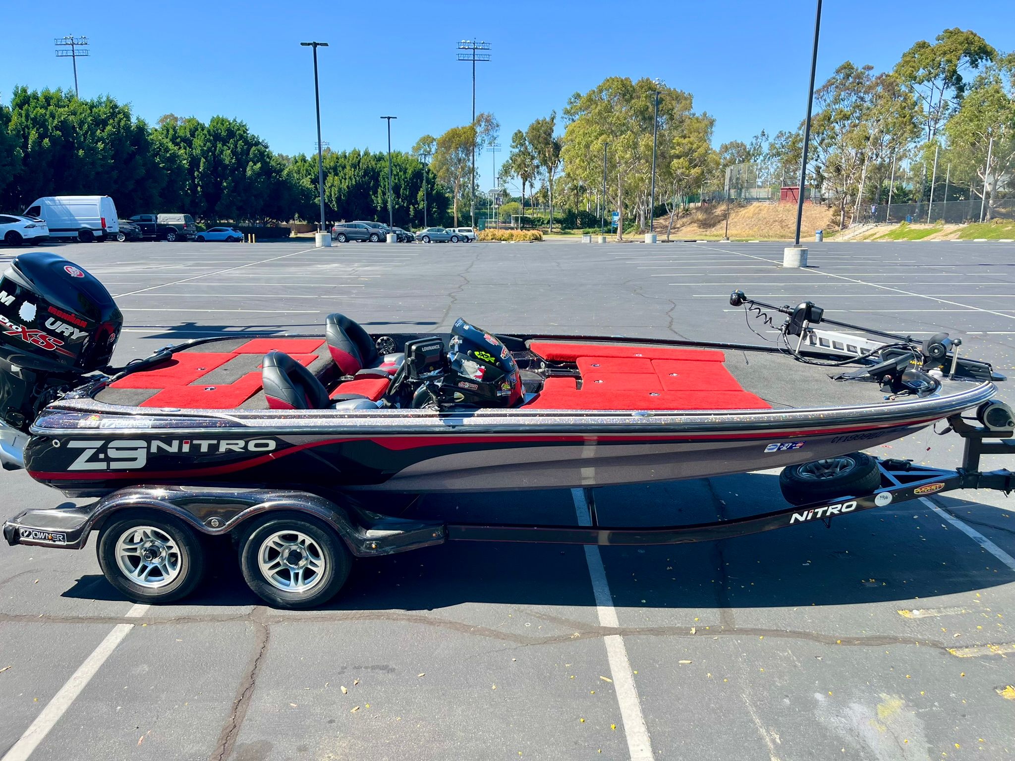 2013 Nitro Z-9 boat in parking lot, red upholstery.