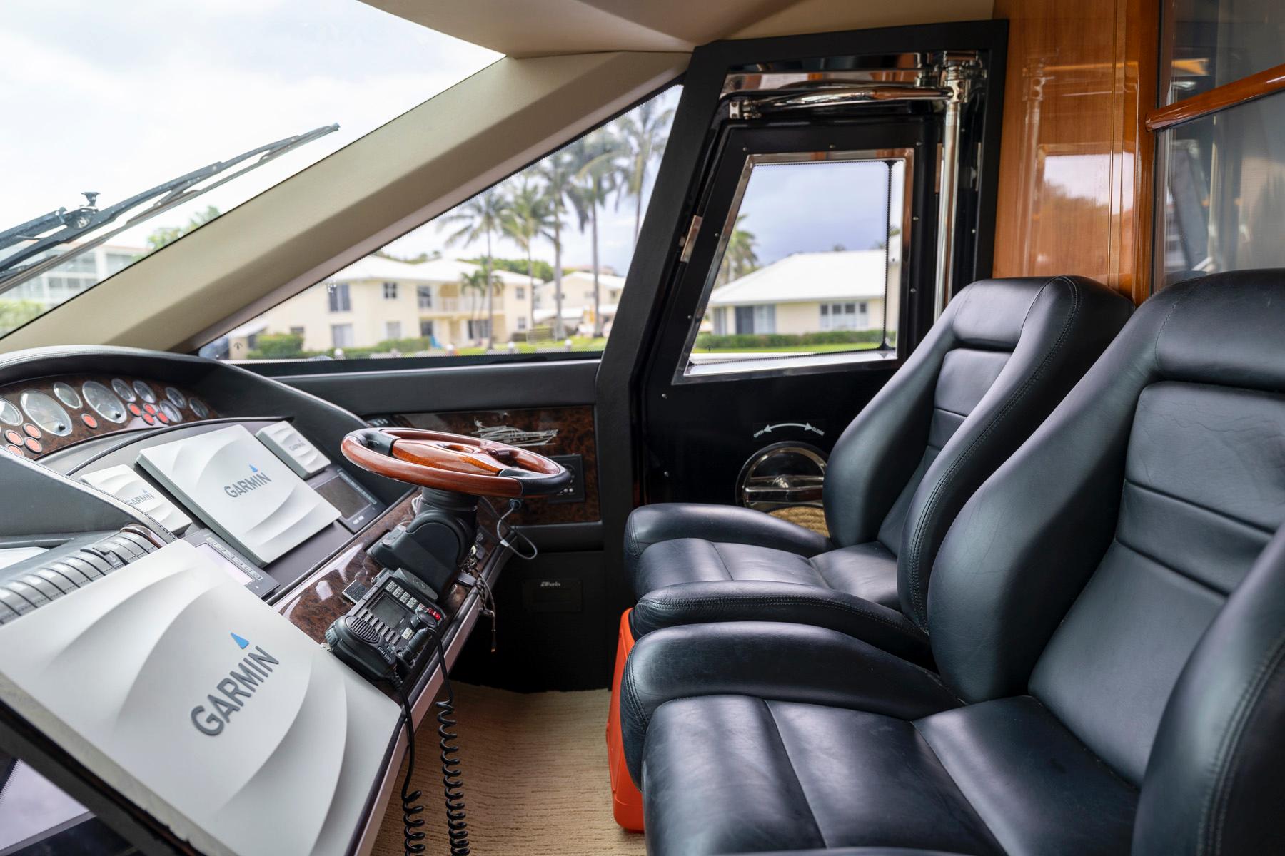 Interior of 2007 Princess 67 Flybridge Yacht with leather seats and Garmin navigation.