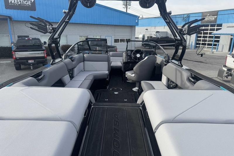 2026 Moomba Tykon boat interior with spacious seating and modern design at a dealership.