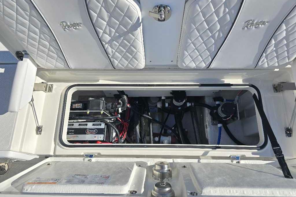 2025 Ranger 2510 Bay boat storage compartment with electrical components and wiring.