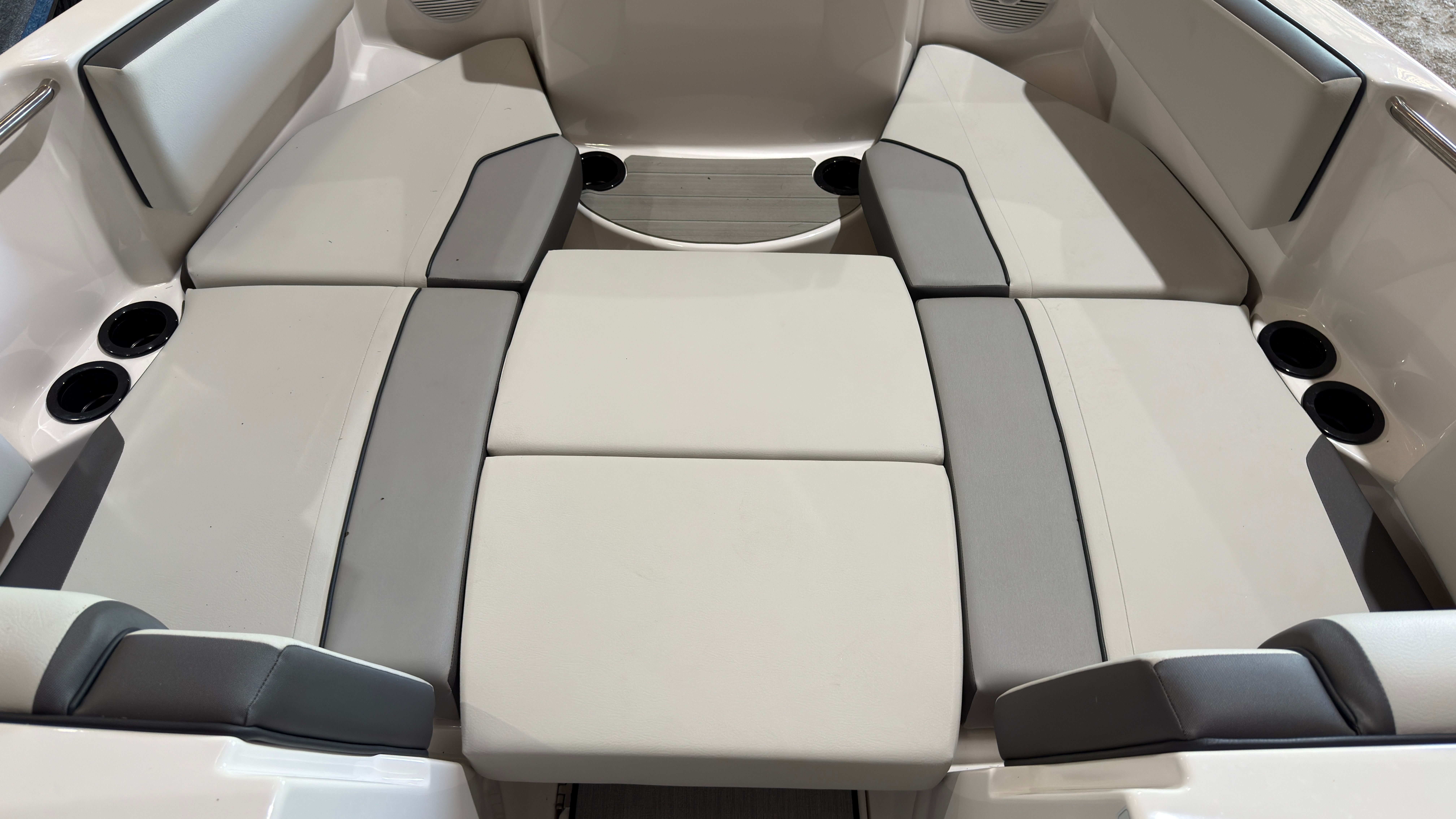 Interior of 2024 Yamaha Boats AR220 with gray upholstery.