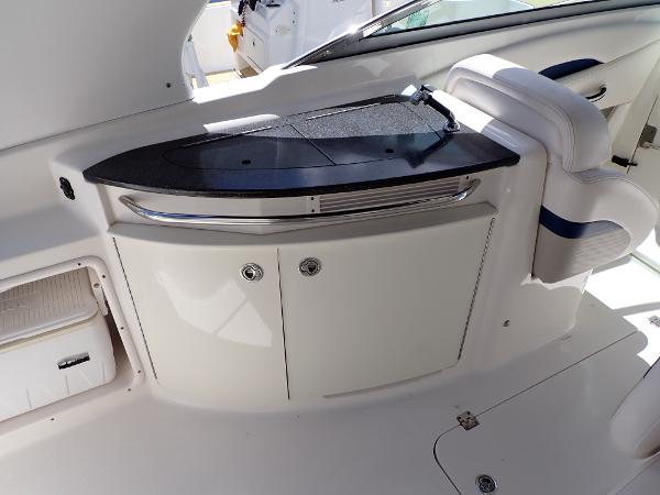 2011 Chaparral 287 SSX boat interior with sleek black countertop and white cabinetry.