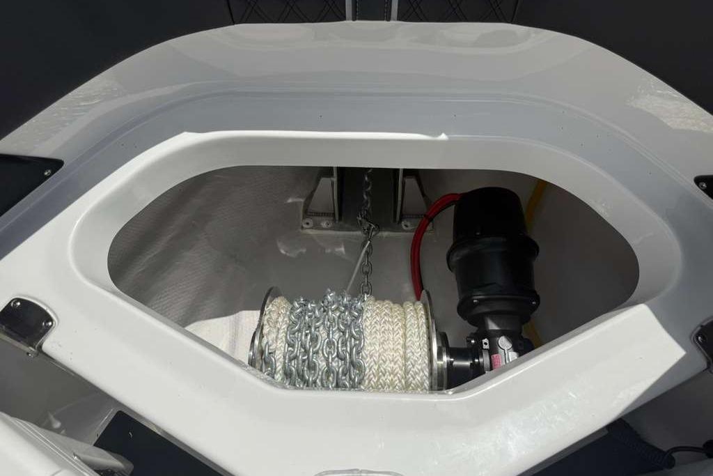 Anchor compartment of 2026 Monterey Elite 30 OB boat with chain and rope.