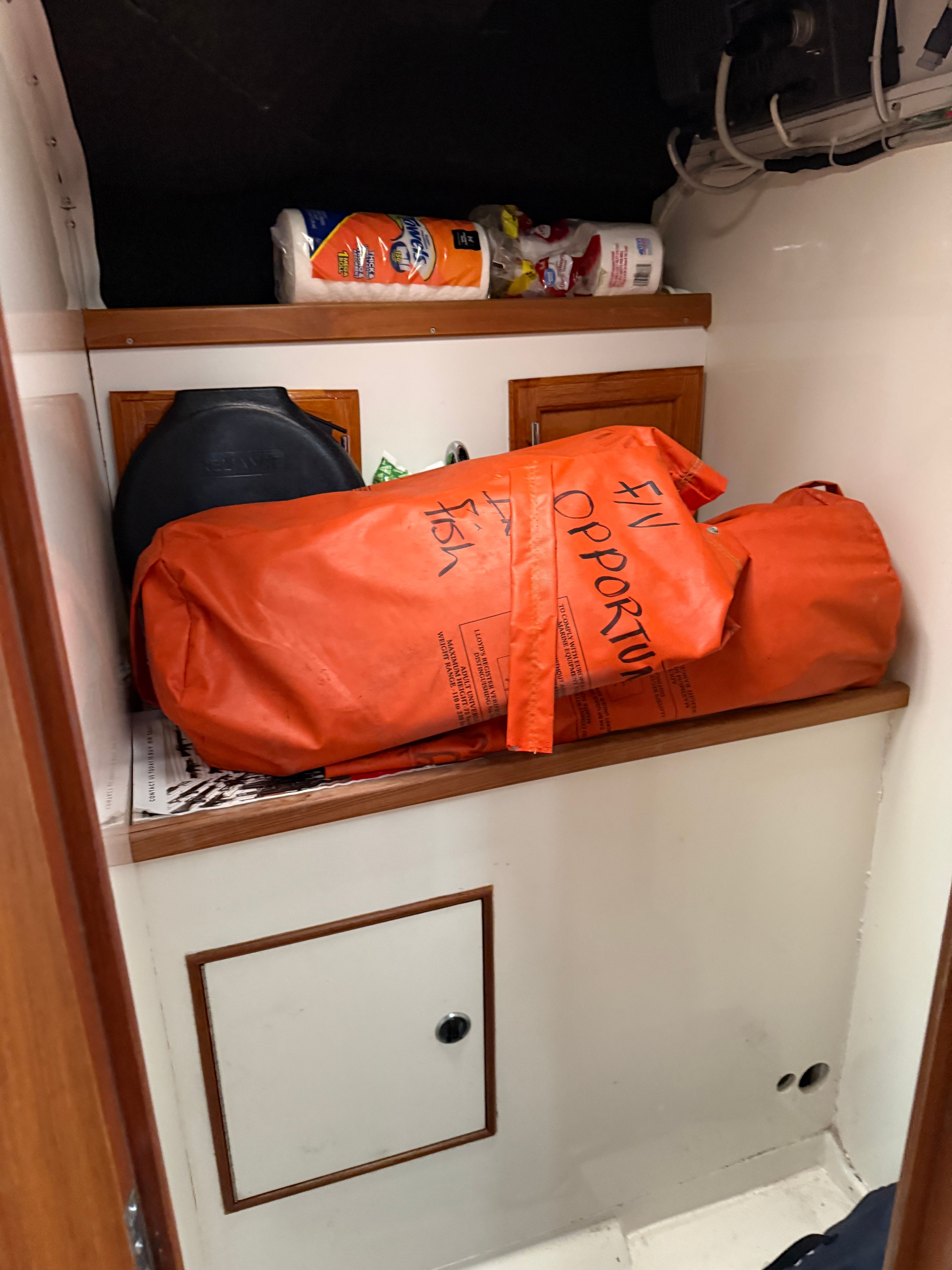 Interior of a Black Watch Custom 35 boat with emergency gear.