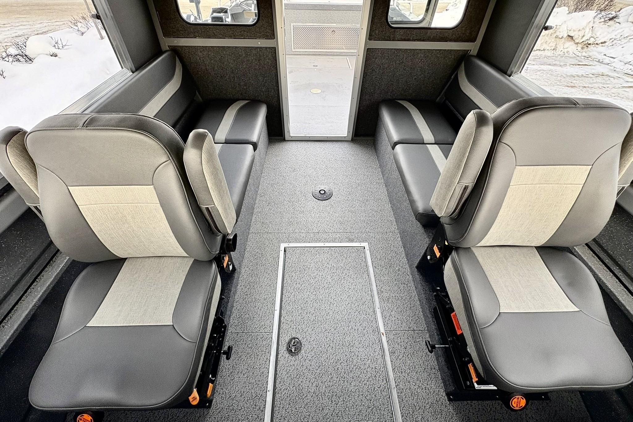 2024 Spartan 26 Maximus Pro XL interior with gray seating and spacious layout.