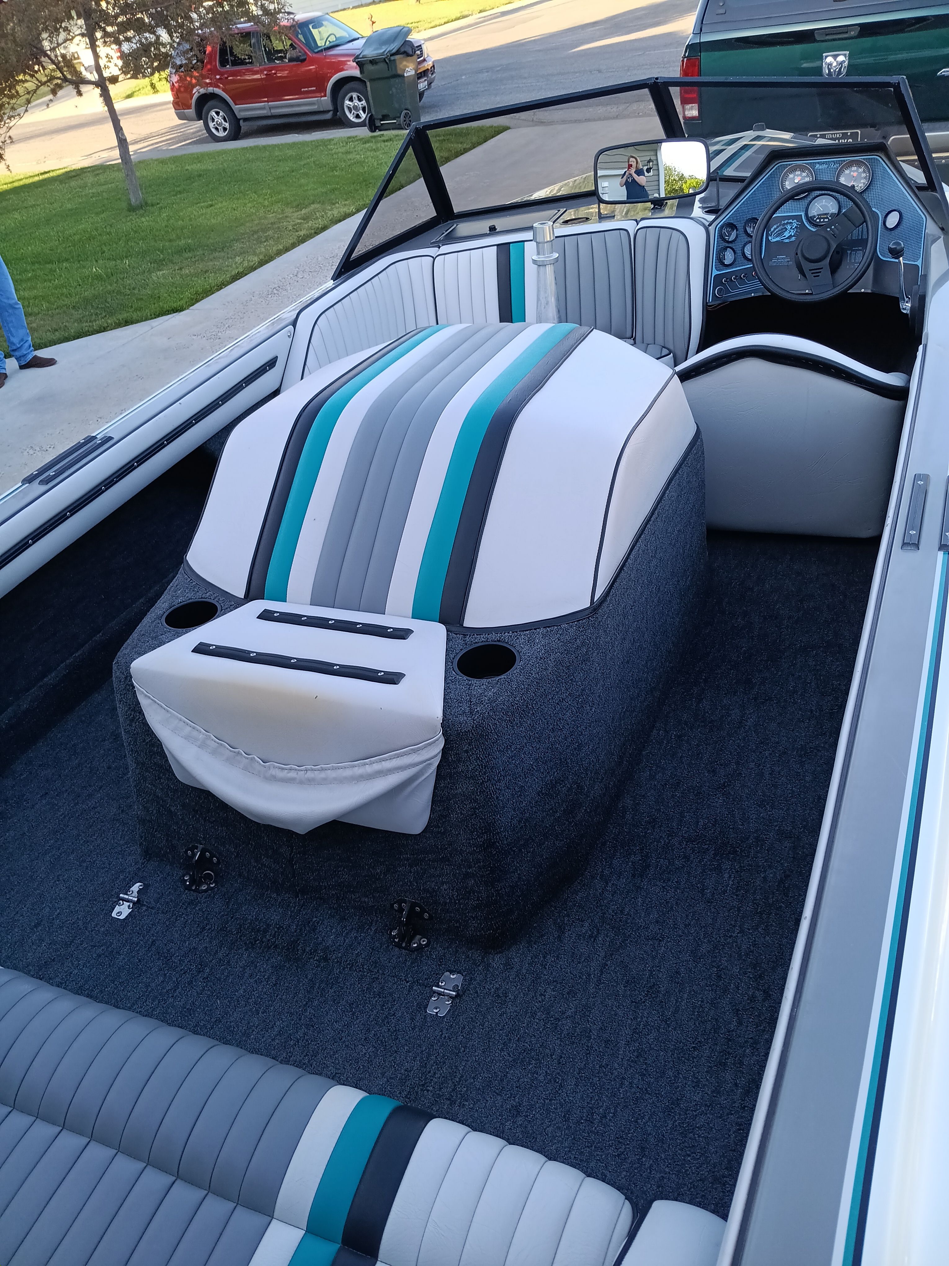 Interior of a 1991 Malibu Skier boat with striped seats.