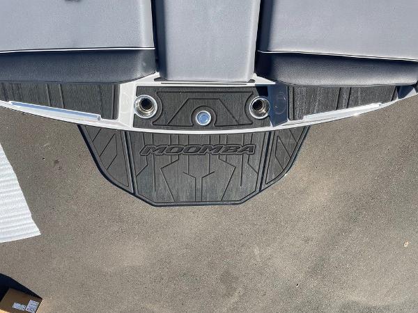 2025 Moomba Mondo boat swim platform with logo and cup holders.