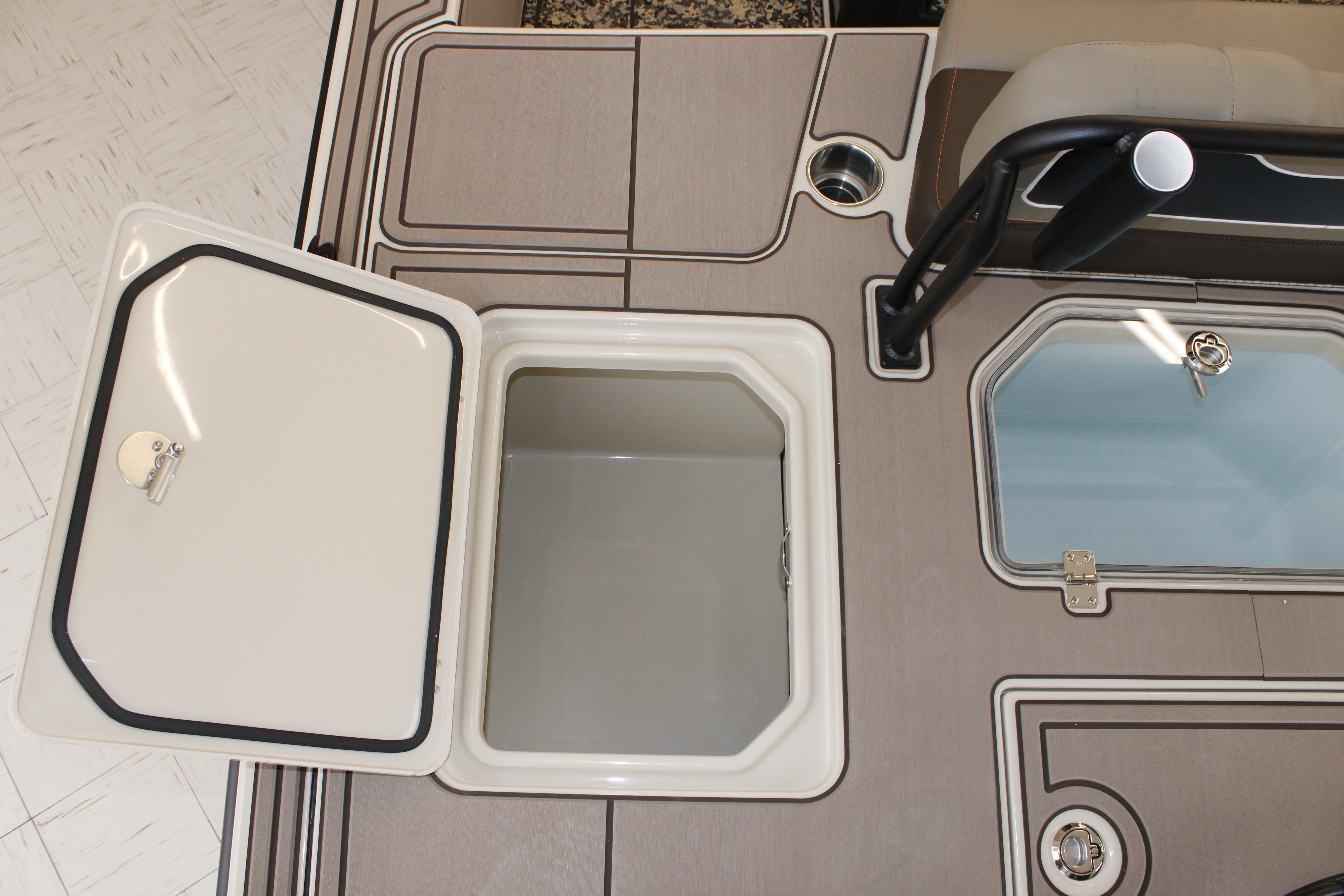 Open storage compartment on 2026 Mako 18 Pro Skiff Backwater Edition boat deck.