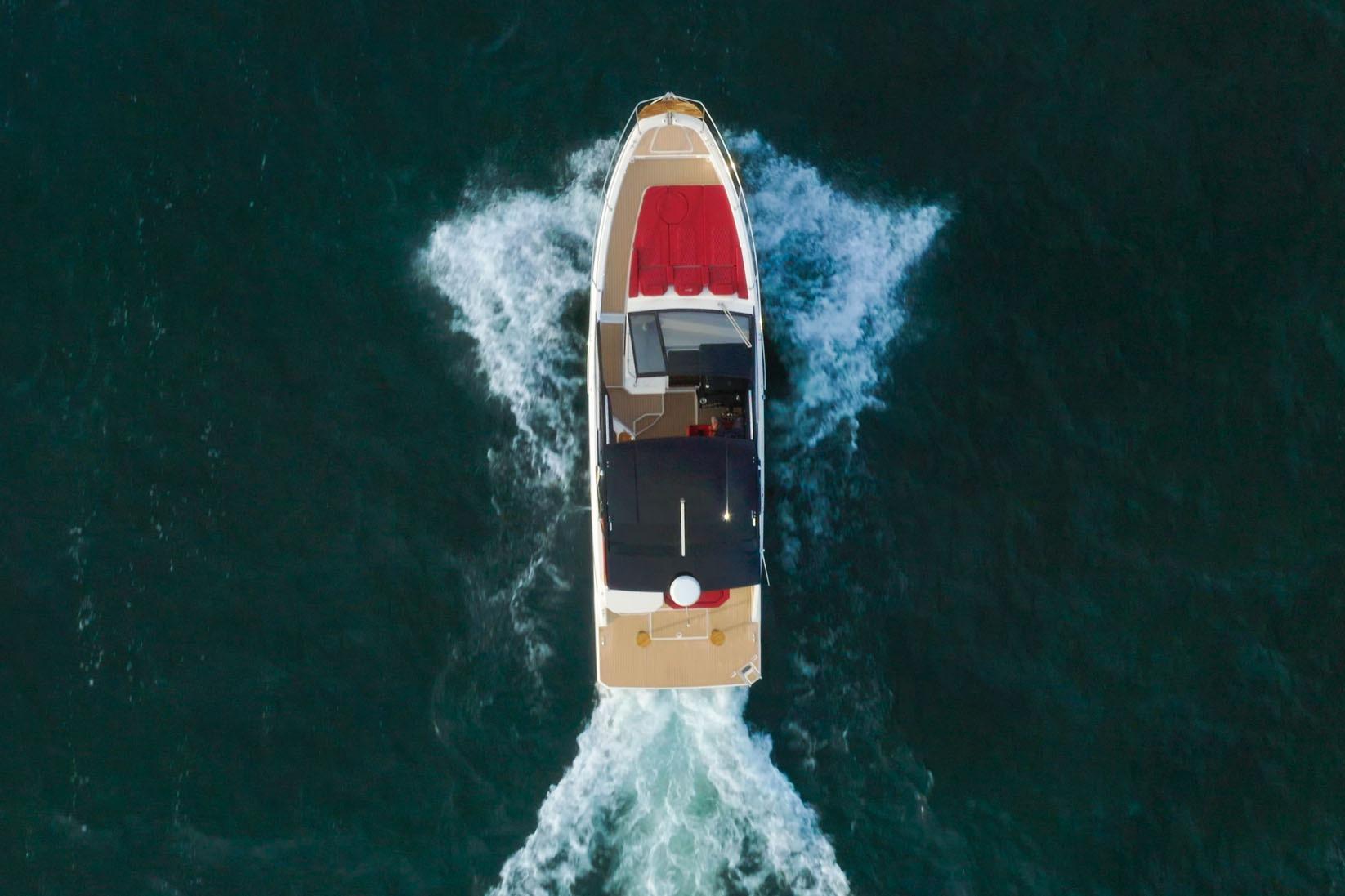 Aerial view of 2026 Hanover 387 boat cruising on open water.