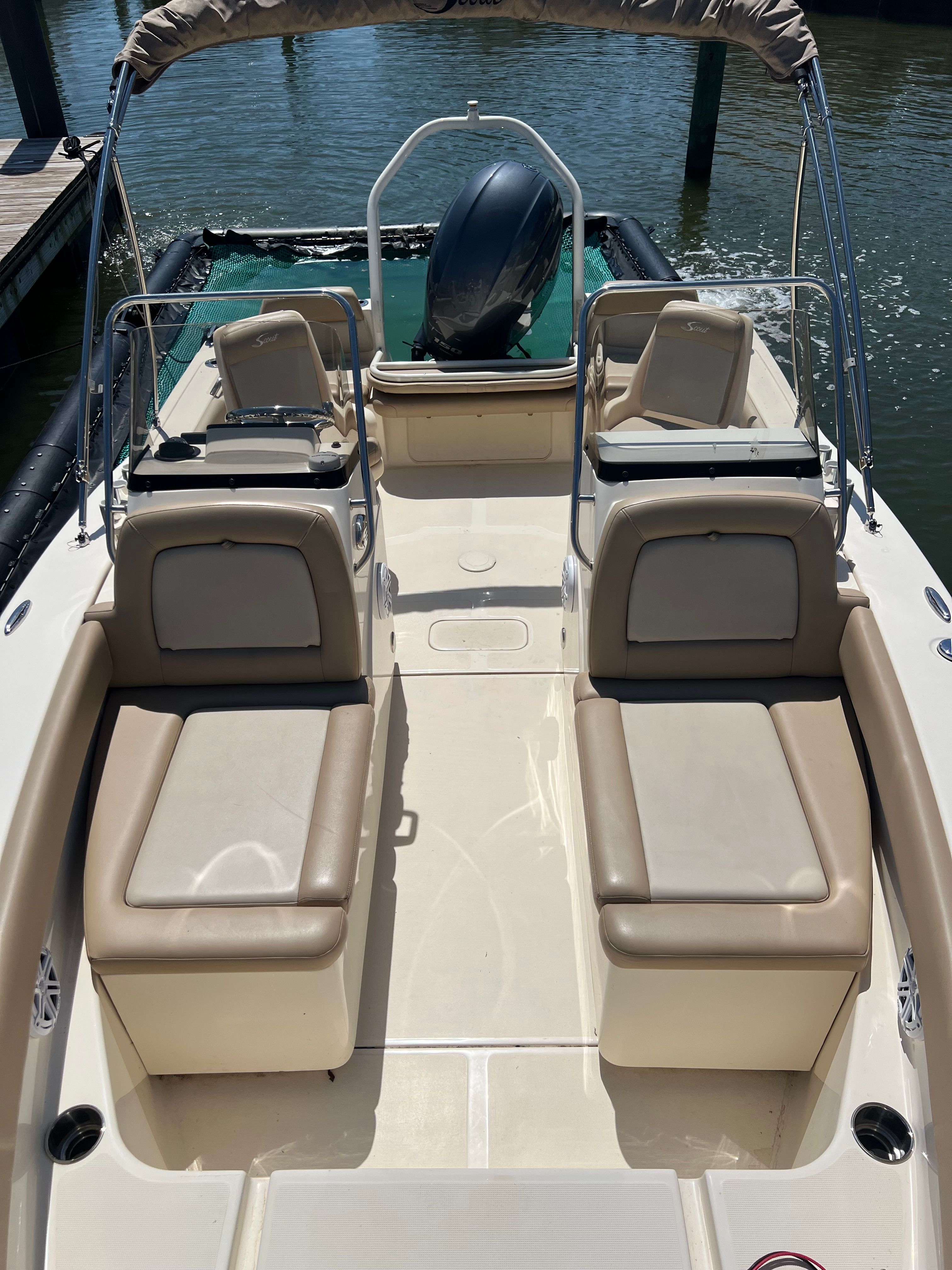 2021 Scout 195 Sport Dorado with beige seating and a black outboard motor.