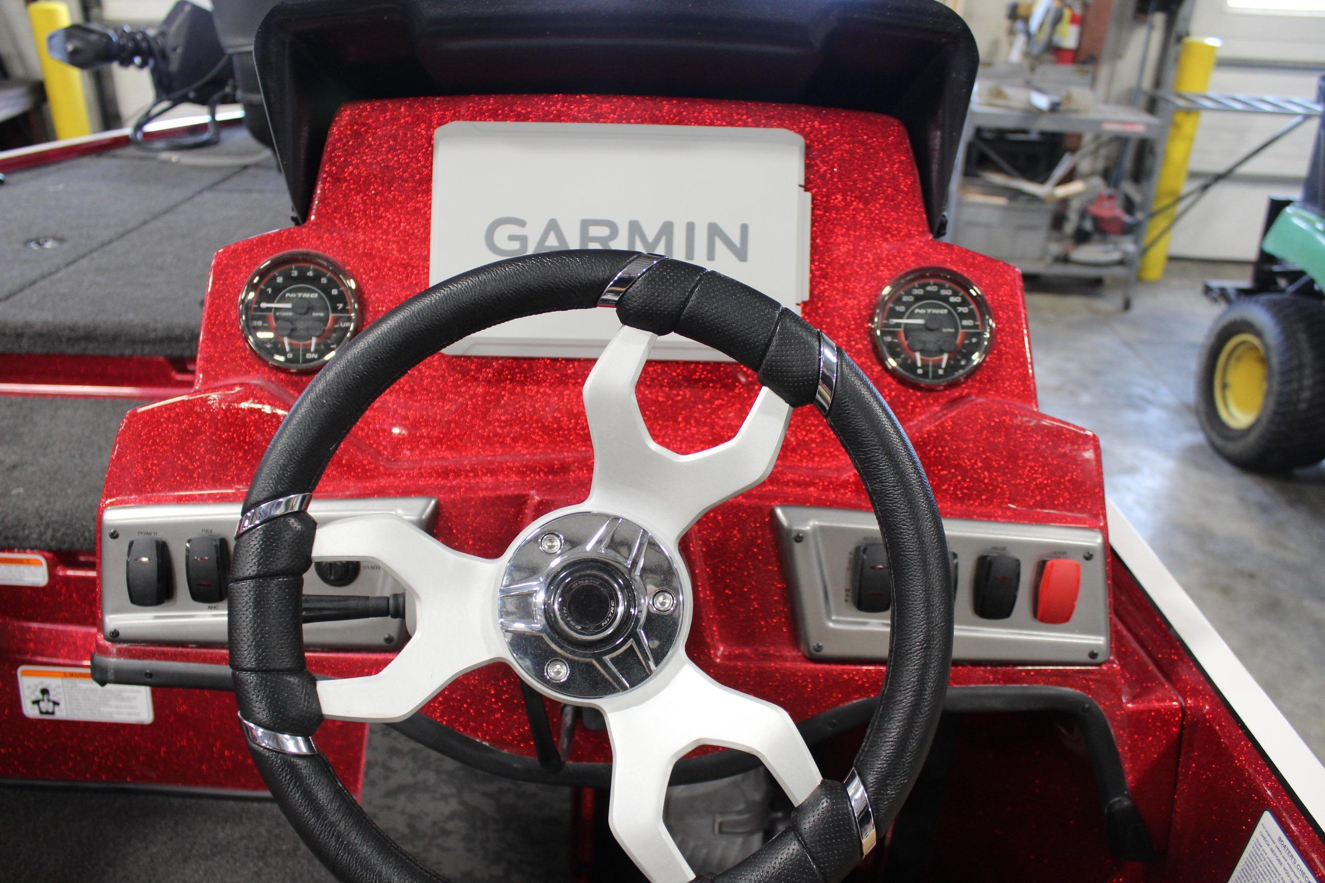 2026 Nitro Z19 XL Pro boat dashboard with Garmin display and steering wheel.