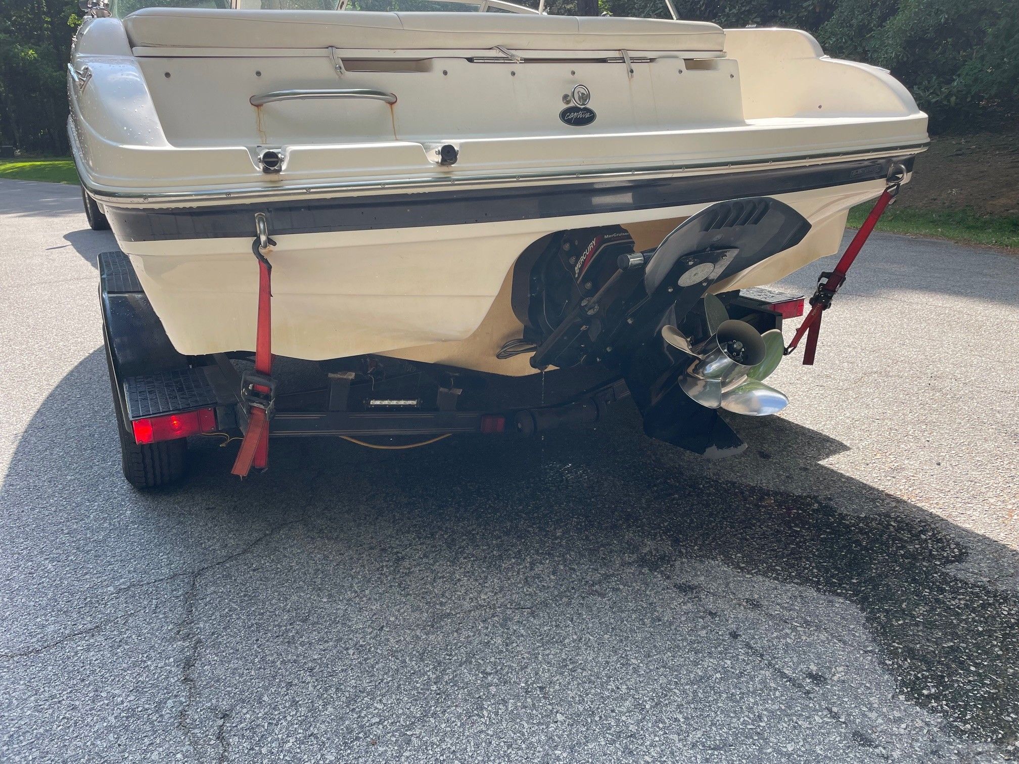 2002 Rinker 212 Captiva Bowrider on trailer, rear view.