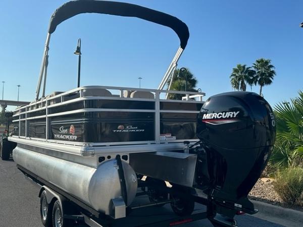 2024 Sun Tracker SportFish 22 DLX pontoon boat with Mercury outboard motor.