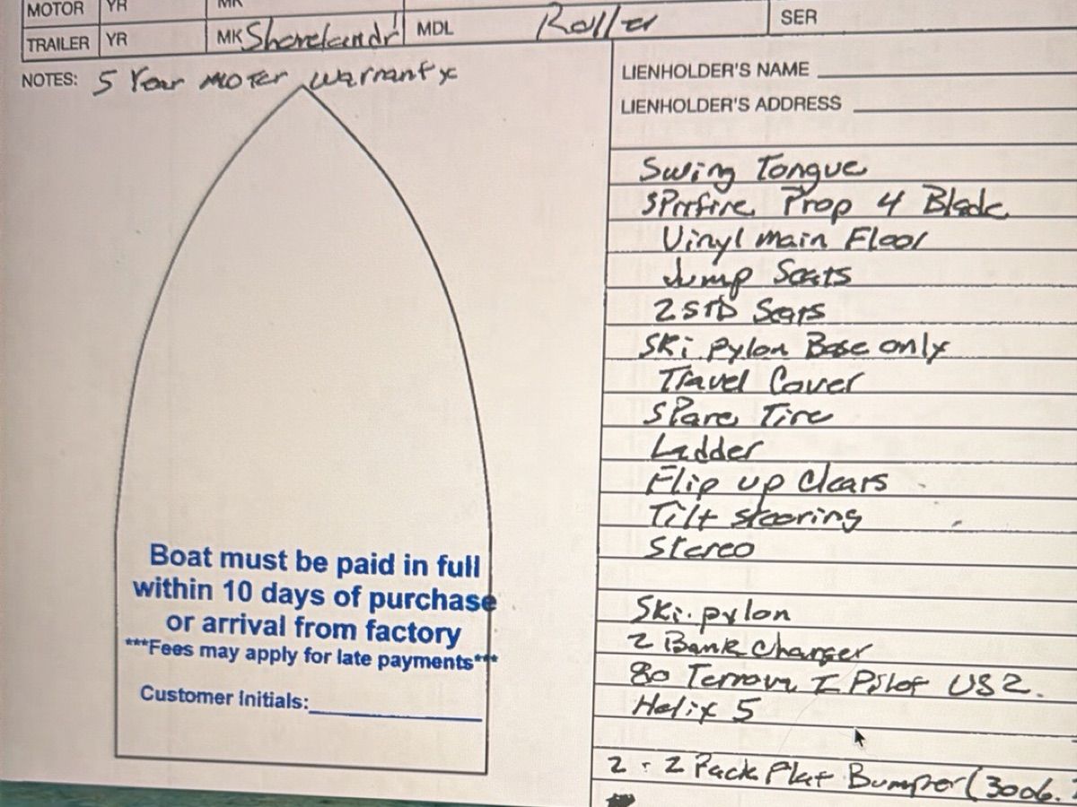 A handwritten list of boat features and payment terms on a form.