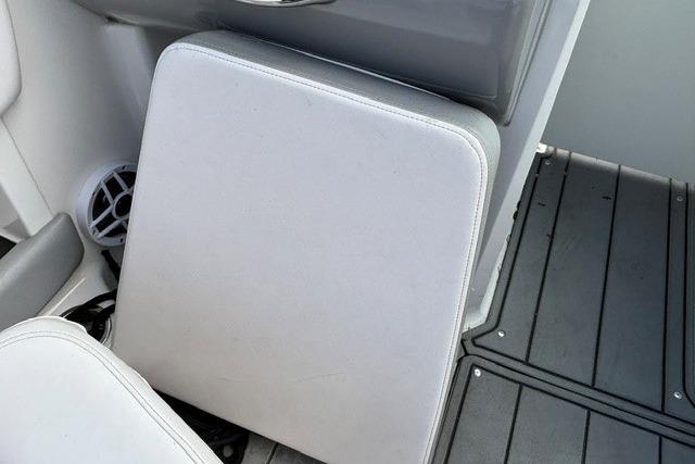 Chaparral 21 SSi 2021 boat interior with cushioned seating and speaker.
