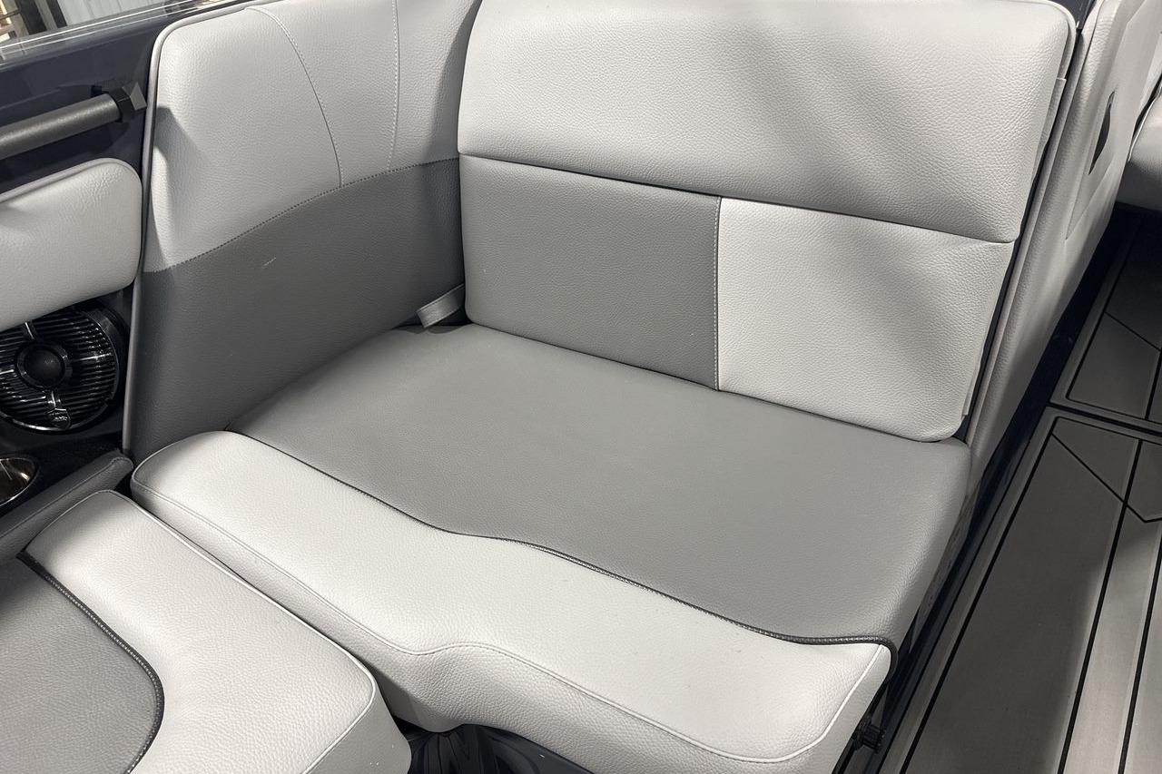 Gray upholstery in a modern boat, with a vent on the side.