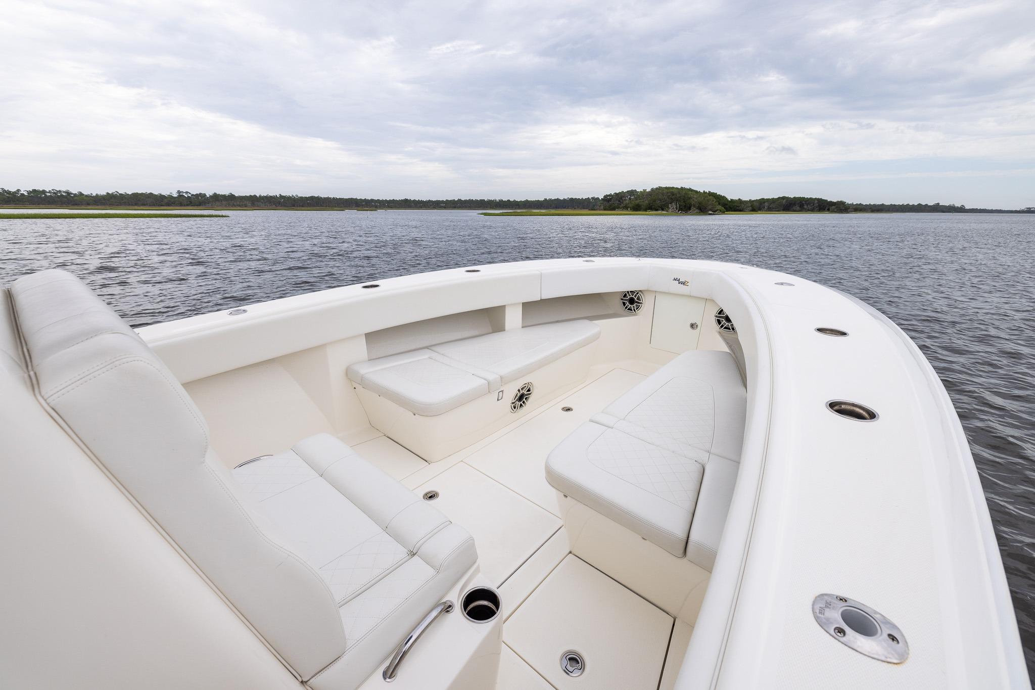 2019 SeaVee 322Z boat interior with white seating on calm water.