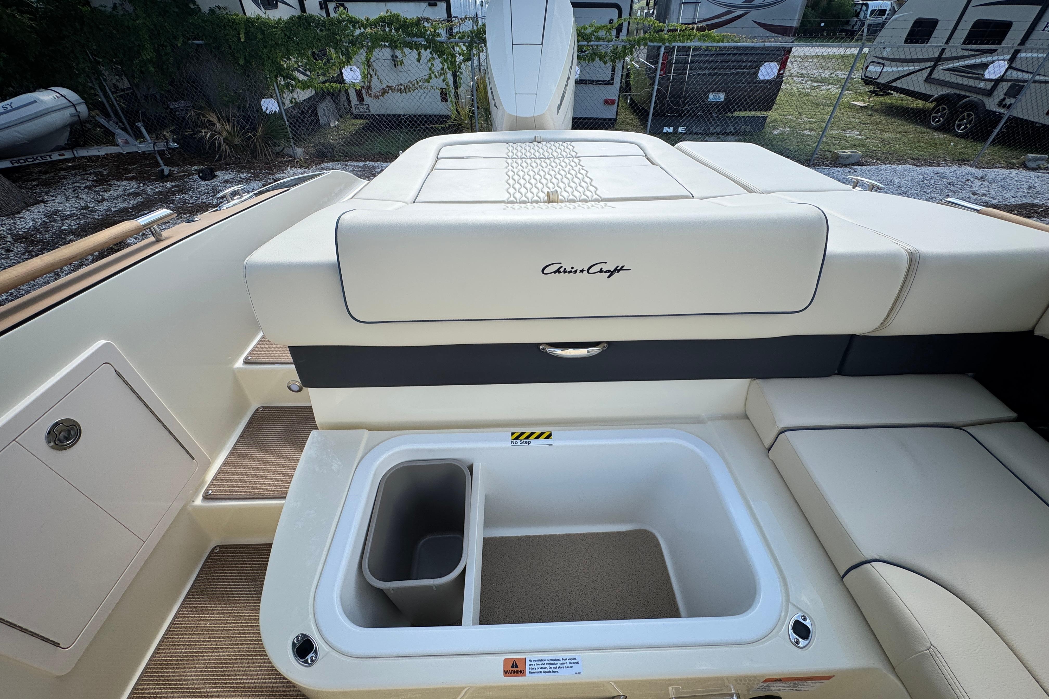 2026 Chris-Craft Sportster 28 boat interior with storage compartment and seating.