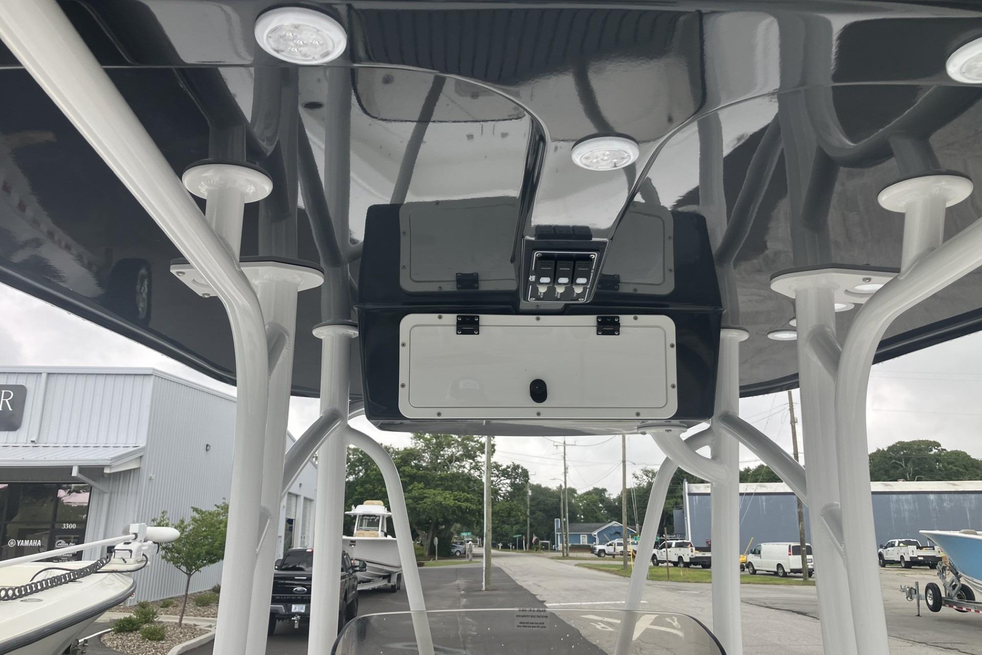 2026 BlackJack 256 Coastal boat's T-top with integrated lighting and storage compartments.