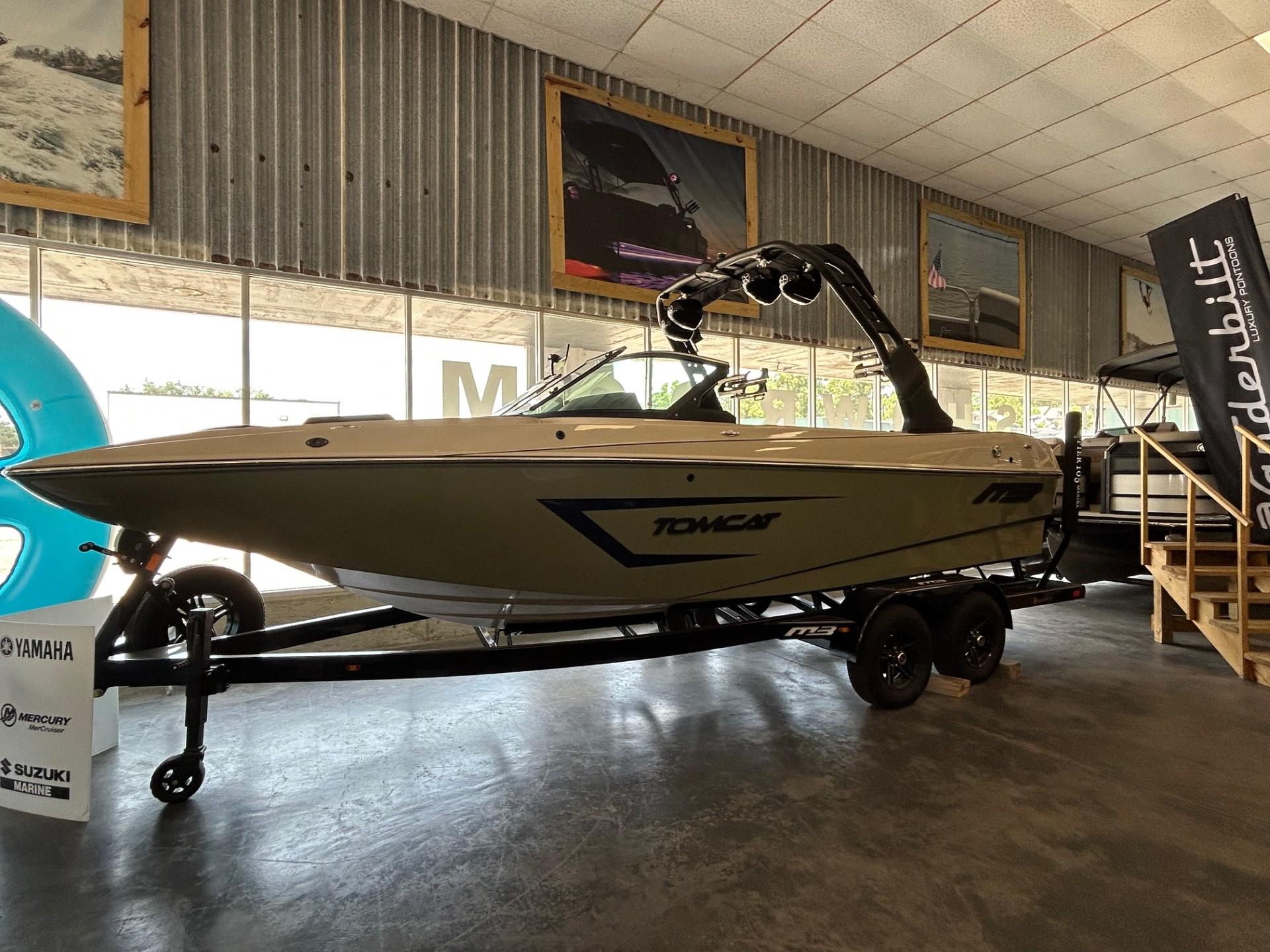 2024 MB F22 Tomcat boat displayed indoors on a trailer.