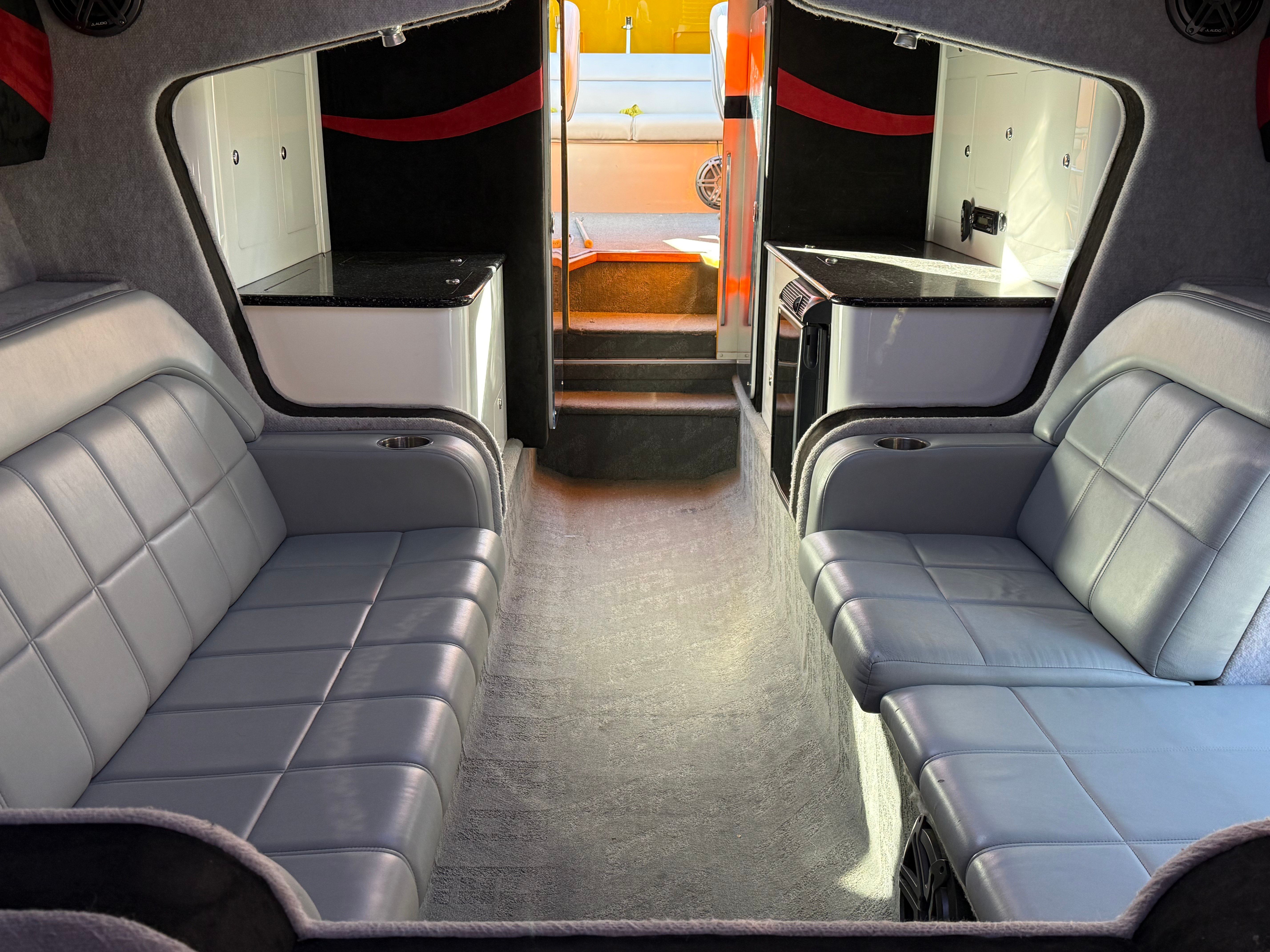 Interior of a 2009 Hallett 400T boat with gray leather seating.