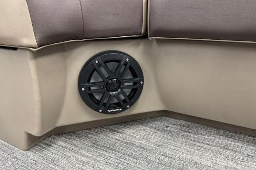 2026 Bennington 22SXSB boat interior with built-in speaker and cushioned seating.