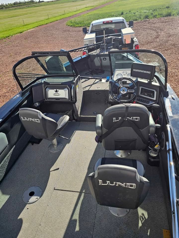 Interior view of a 2020 Lund 1975 Tyee boat with modern equipment.