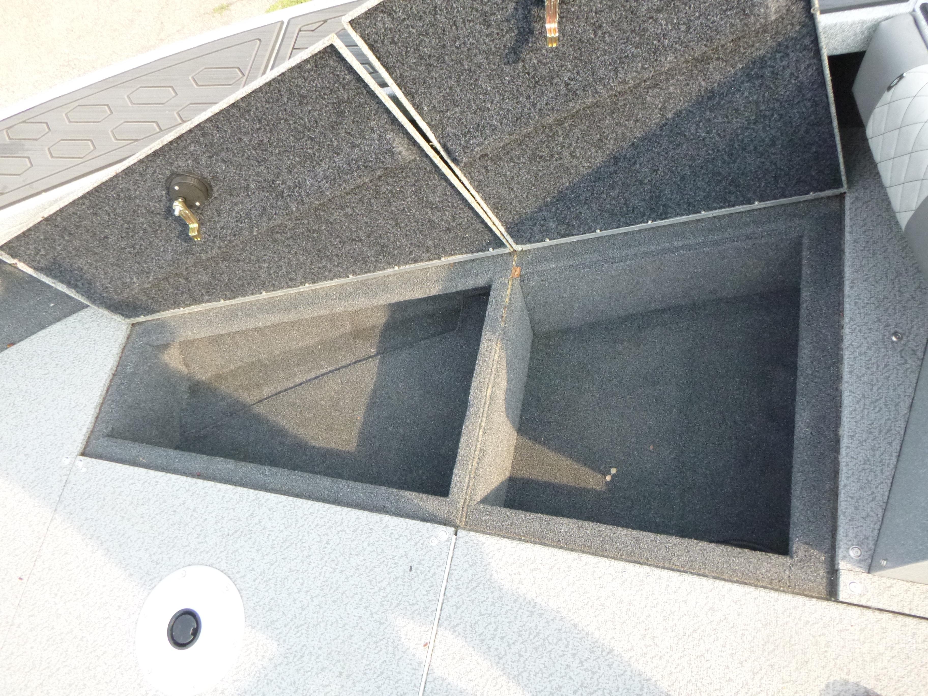 Open storage compartments on a 2025 KingFisher 2125 Arrow Sport boat.