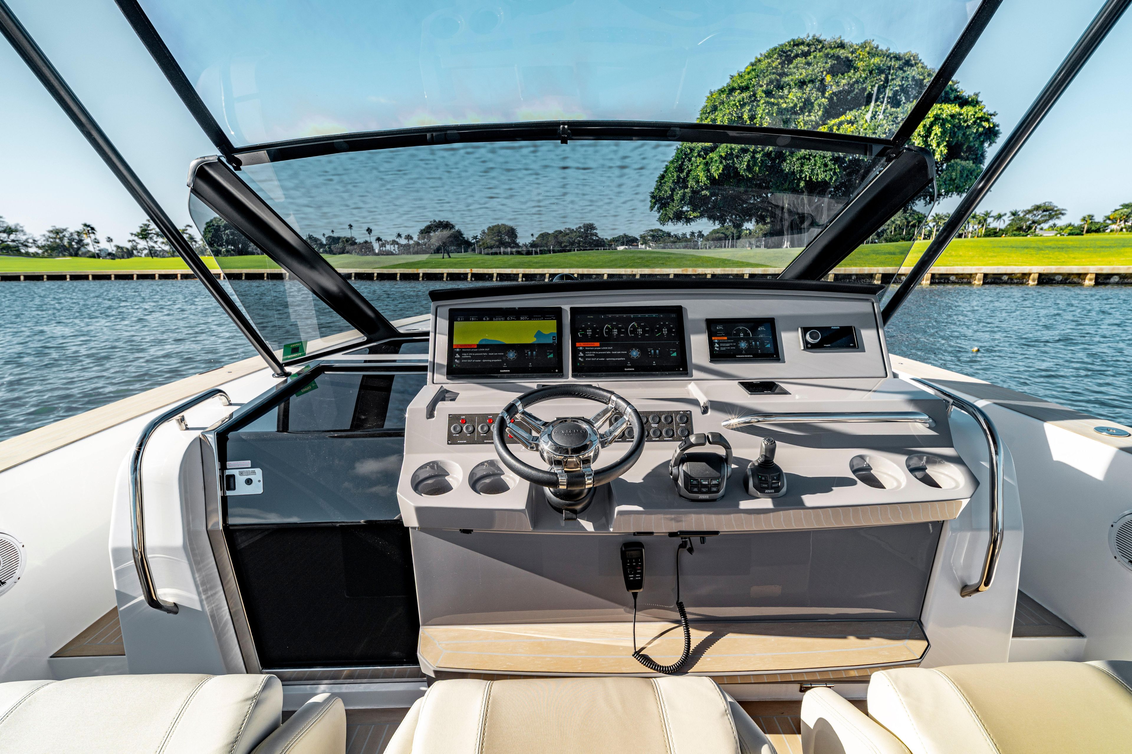 2024 Pardo Yachts P43 helm with modern controls and scenic water view.