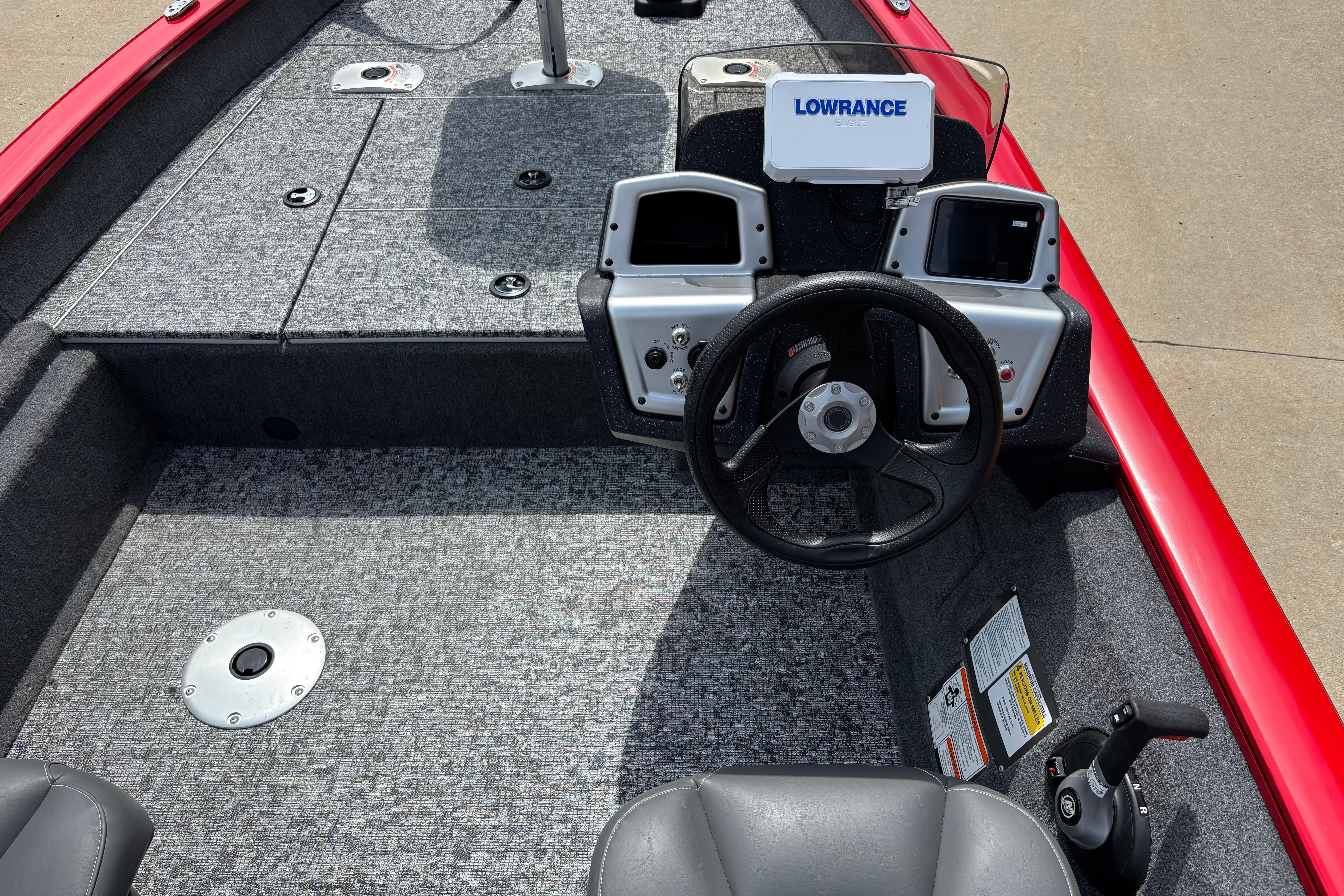 2026 Tracker Pro Team 175 Crappie Edition boat interior with steering wheel and Lowrance electronics.