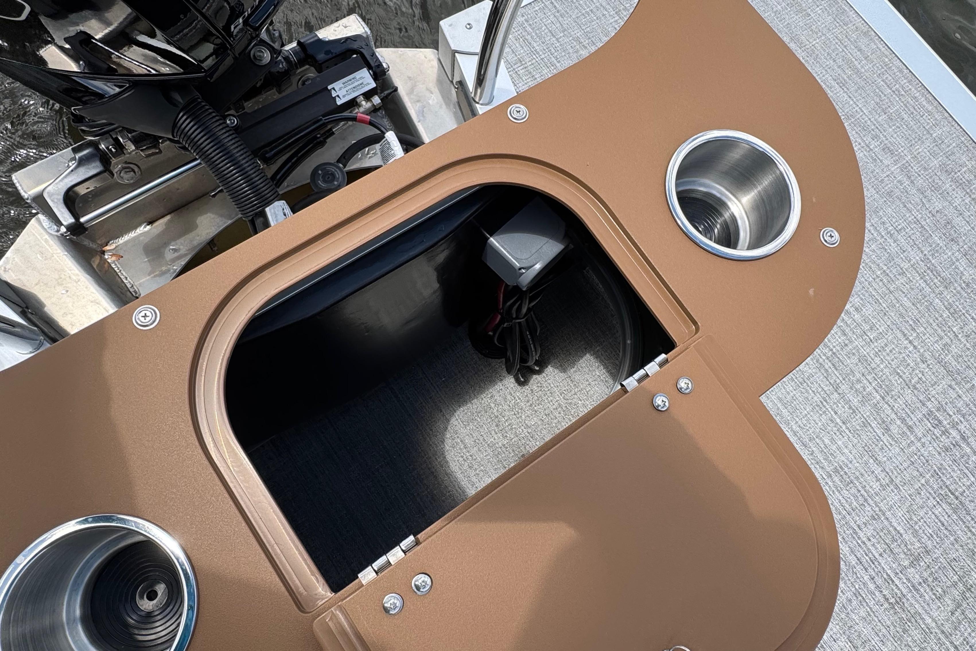 Open storage compartment on 2026 Tahoe Pontoon Sport 85 Cruise Rear Bench 23 boat.