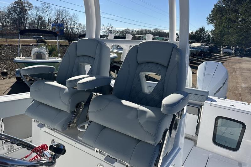 2026 Sportsman Open 282 Center Console boat with dual cushioned seats.