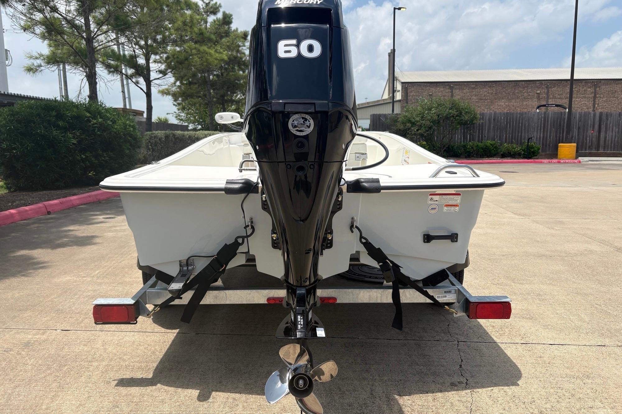 2026 Mako Pro Skiff 15 CC boat with a 60 HP Mercury outboard motor.