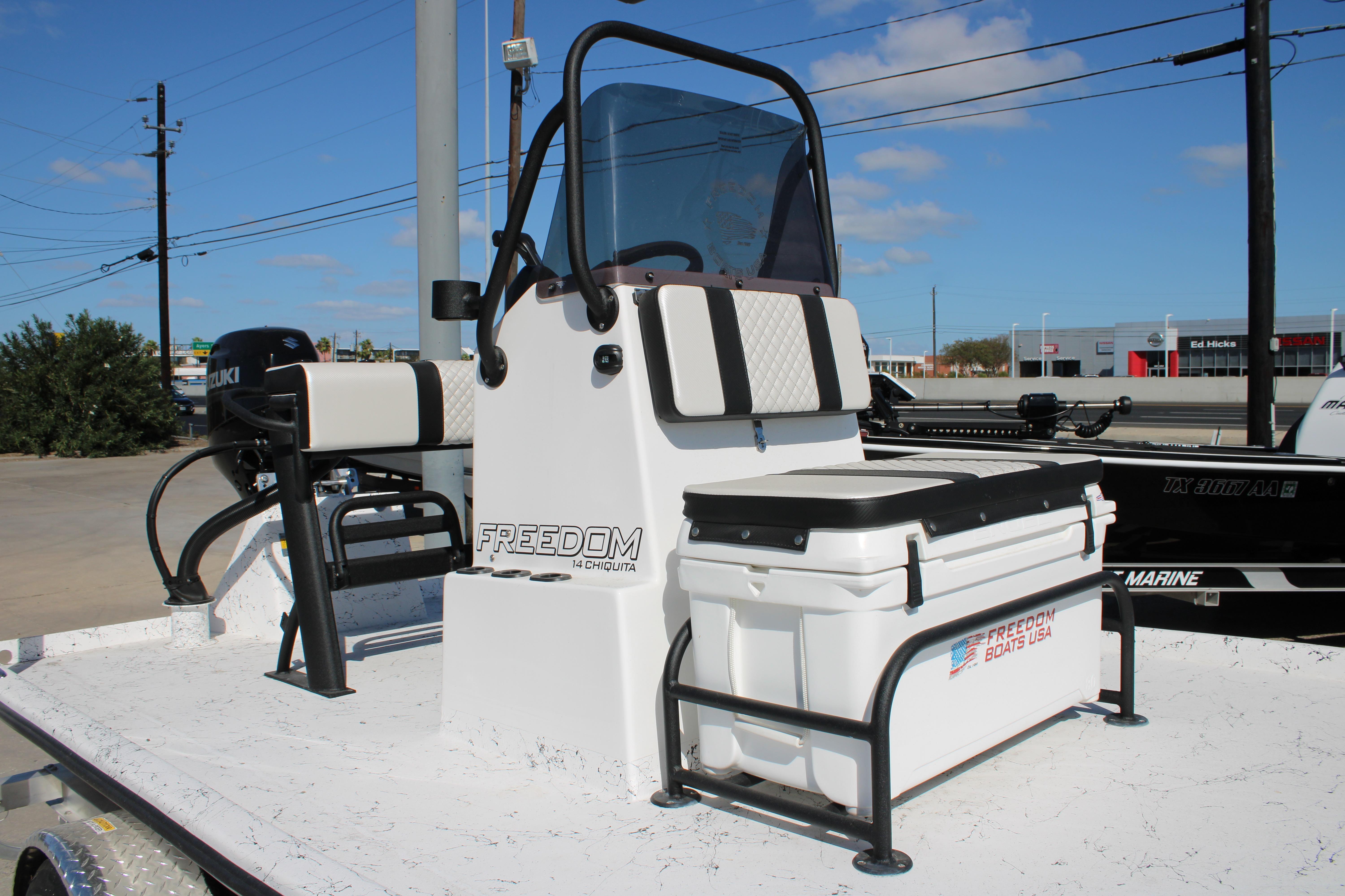 2026 Freedom Boats Chiquita with Suzuki engine, featuring a sleek console and seating.