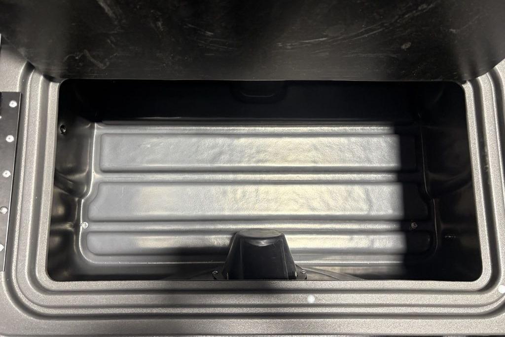 Empty storage compartment in 2026 Sun Tracker PARTY BARGE® 20 DLX boat.