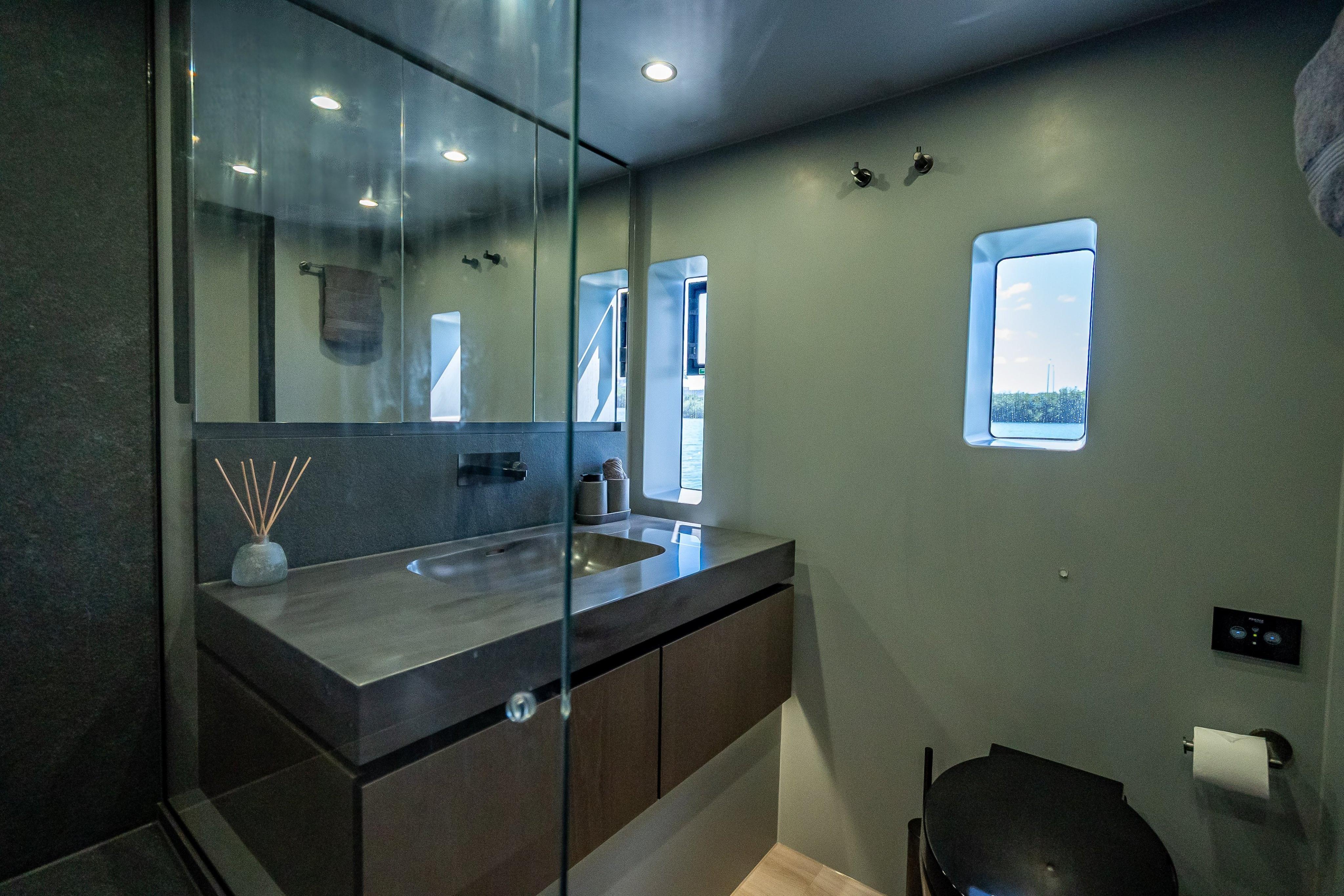 Luxurious bathroom interior of 2026 Sunreef 60 Power yacht with modern fixtures.