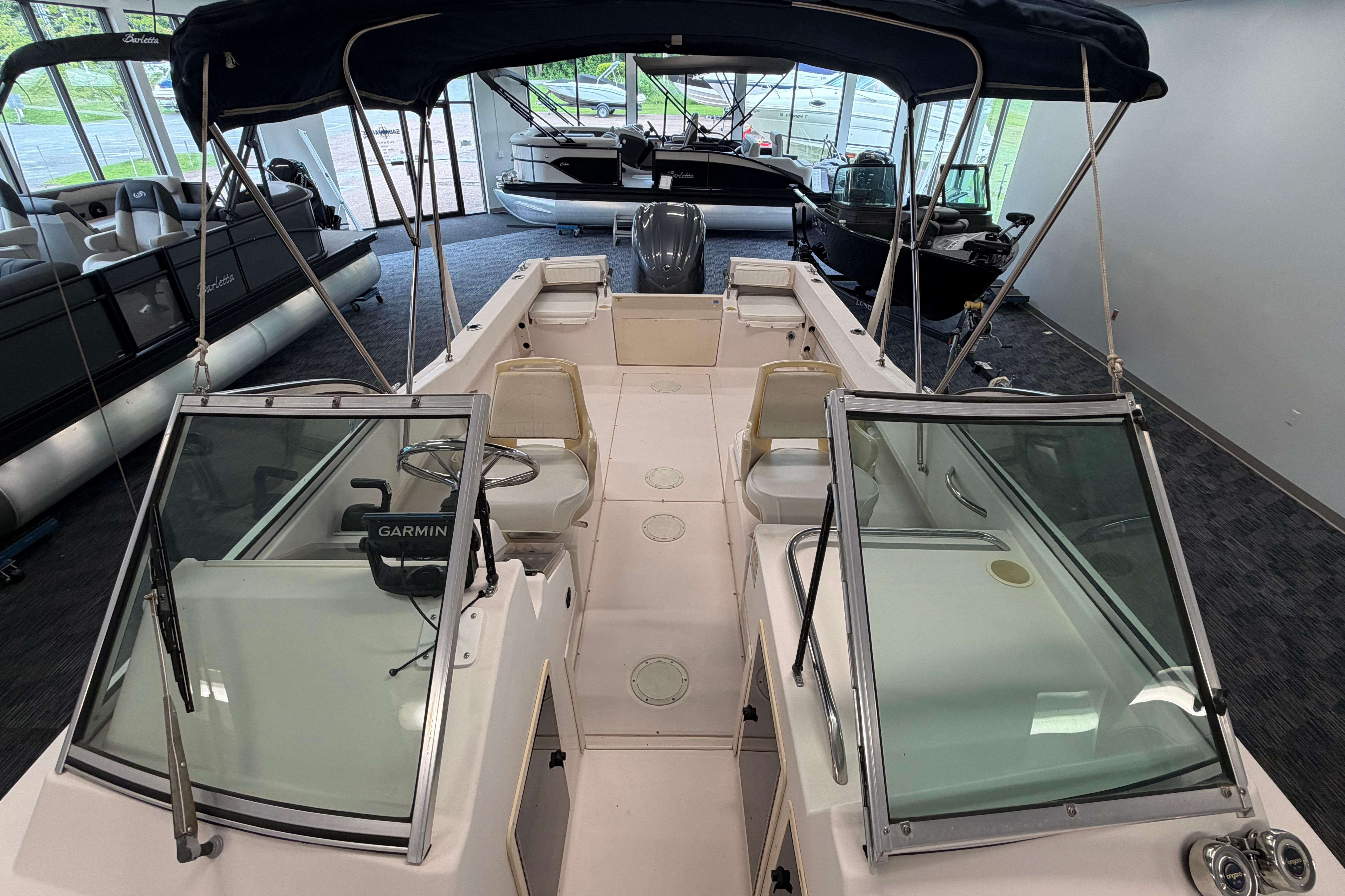 2001 Grady-White Tournament 223 boat with Garmin equipment, displayed indoors.